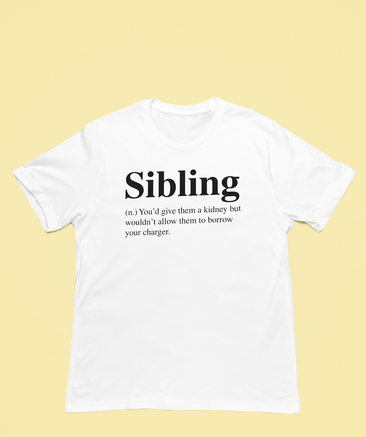 'Sibling' definition T-shirt in white, flat lay on pale yellow background, funny sibling humor gift tee