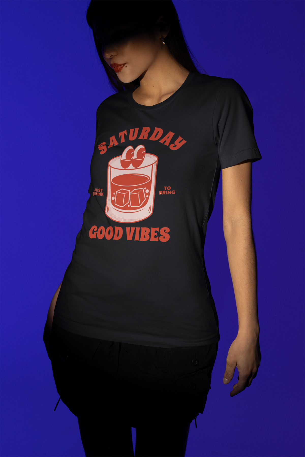 'Saturday Good Vibes' cocktail t-shirt in black, woman modeling it, funny weekend gift shirt