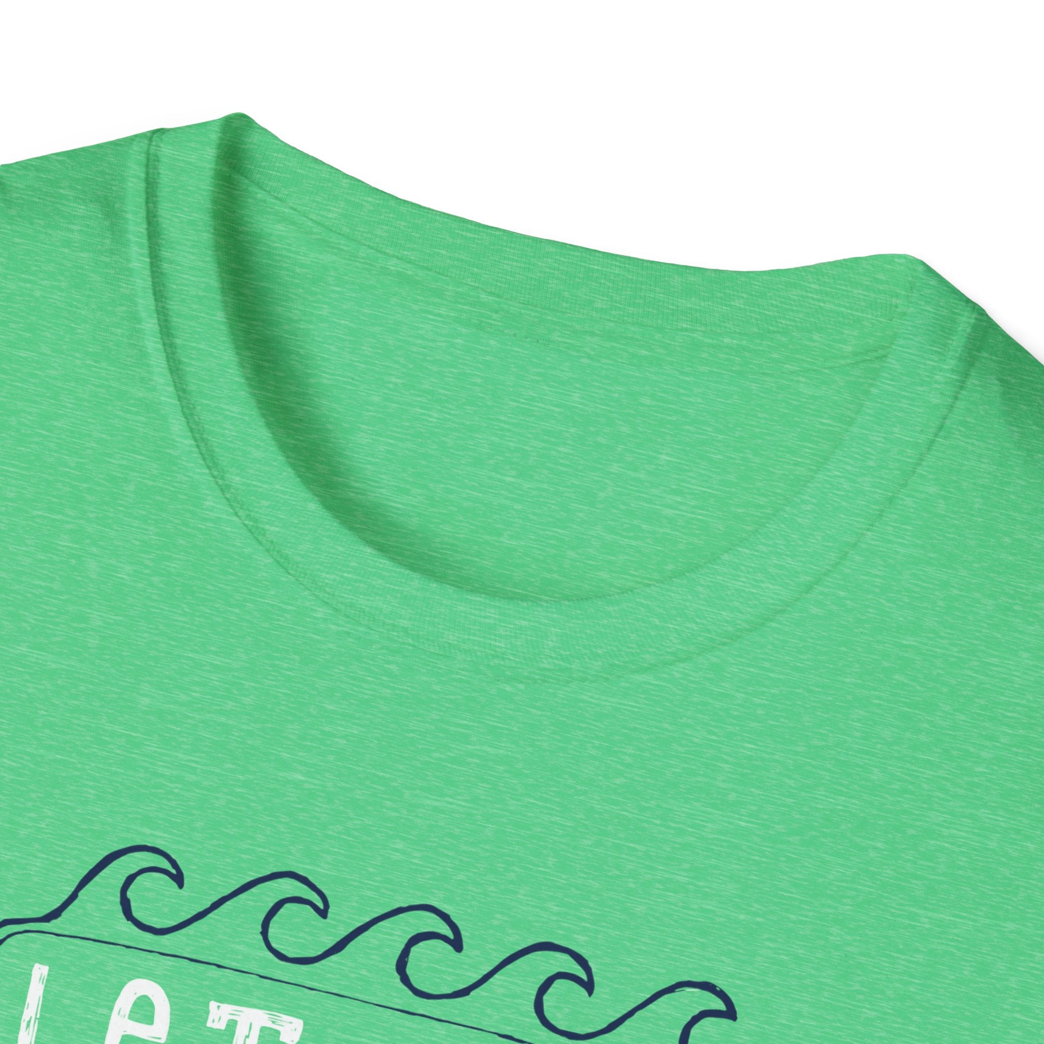 A close-up of the "Let the Waves Take You On a Journey T-Shirt" highlights its green hue and round neckline, featuring waves and text that evoke themes of self-discovery and unseen destinations.