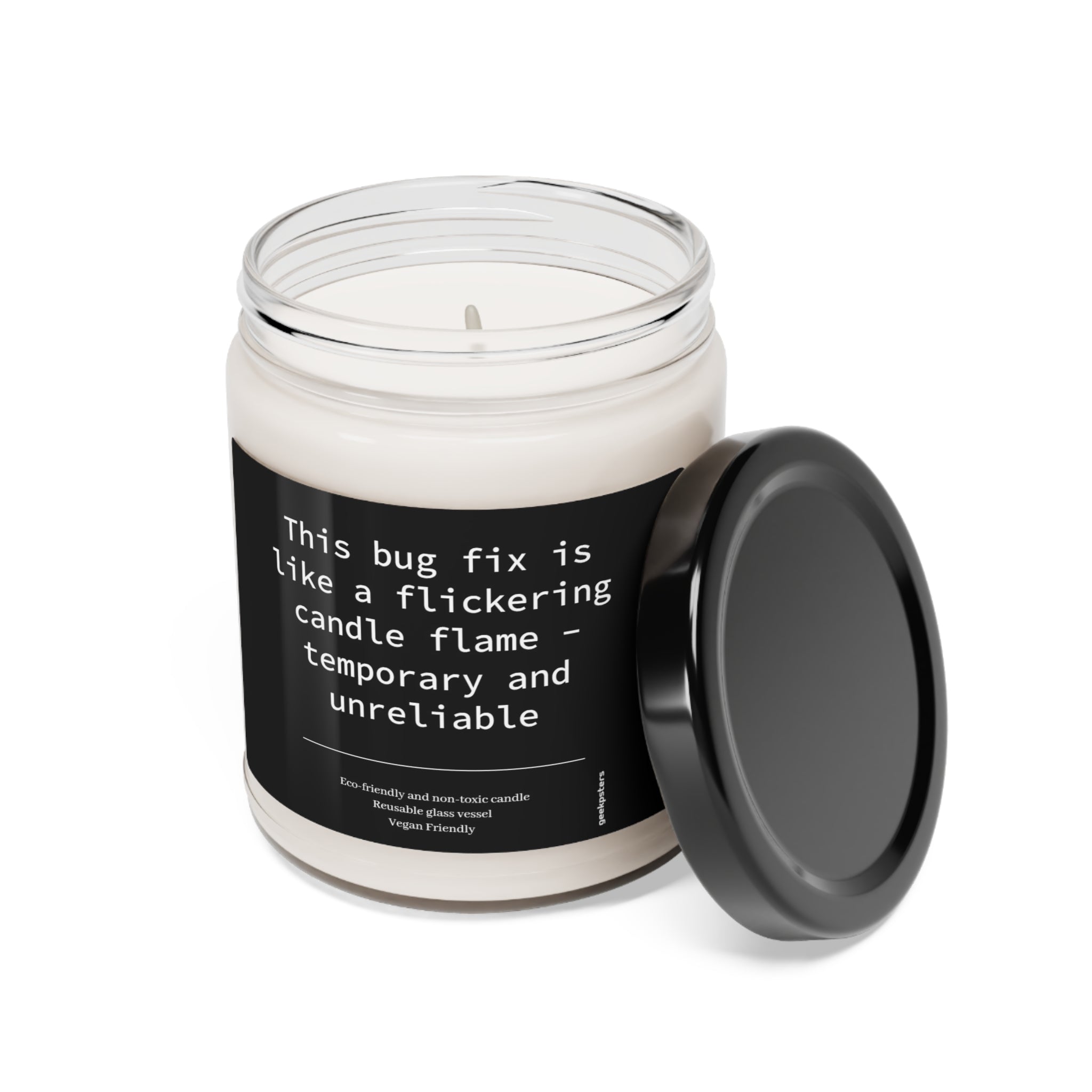 This Bug Fix is Like a Flame - Scented Soy Candle, 9oz with a humorous label comparing a bug fix to a flickering candle flame, indicating it is temporary and unreliable, features a natural soy wax blend.