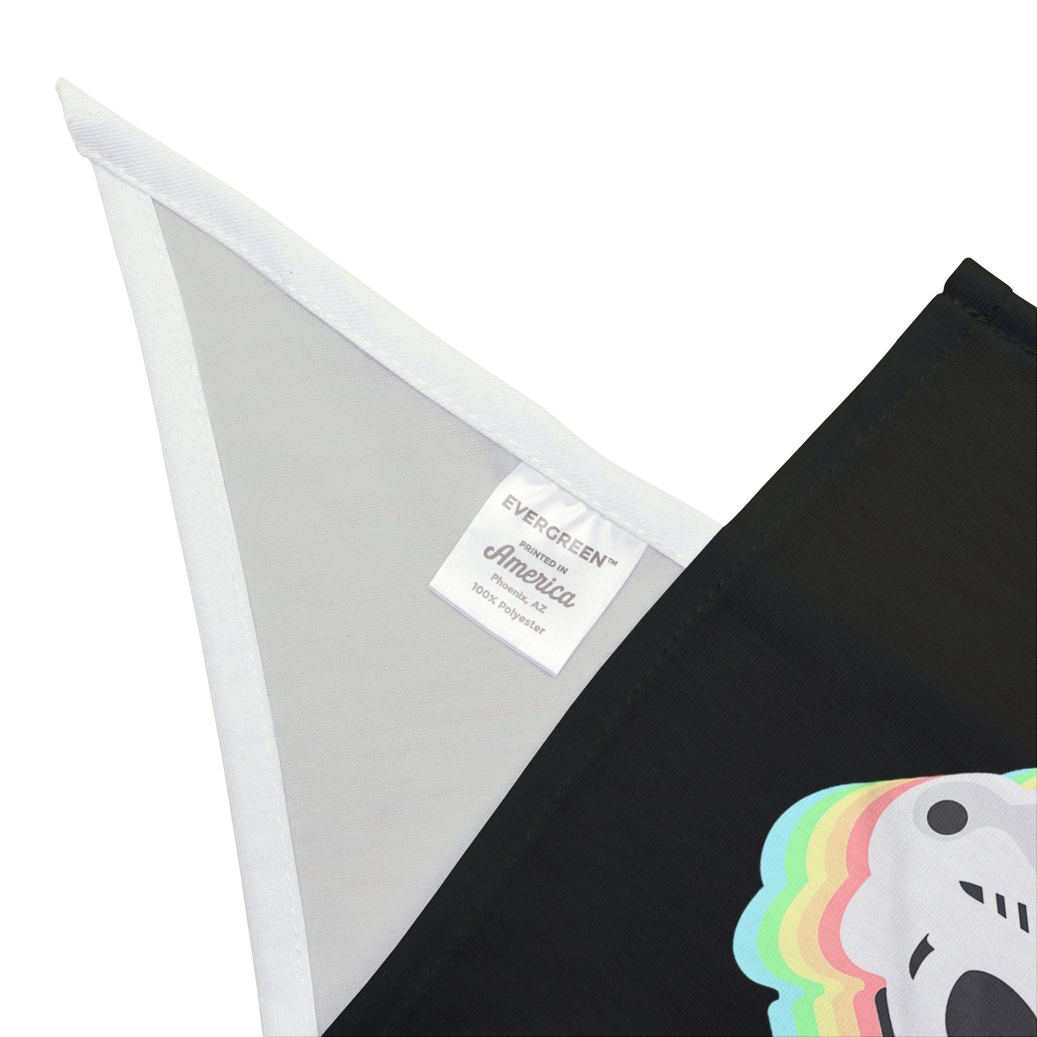 Close-up of a folded fabric with a white label that reads "EVERGREEN America 100% Polyester." The Star Wars Easter Stormtrooper - Pet Bandana, perfect for crafting a pet bandana, features colorful lines and partial white graphics on a black background.