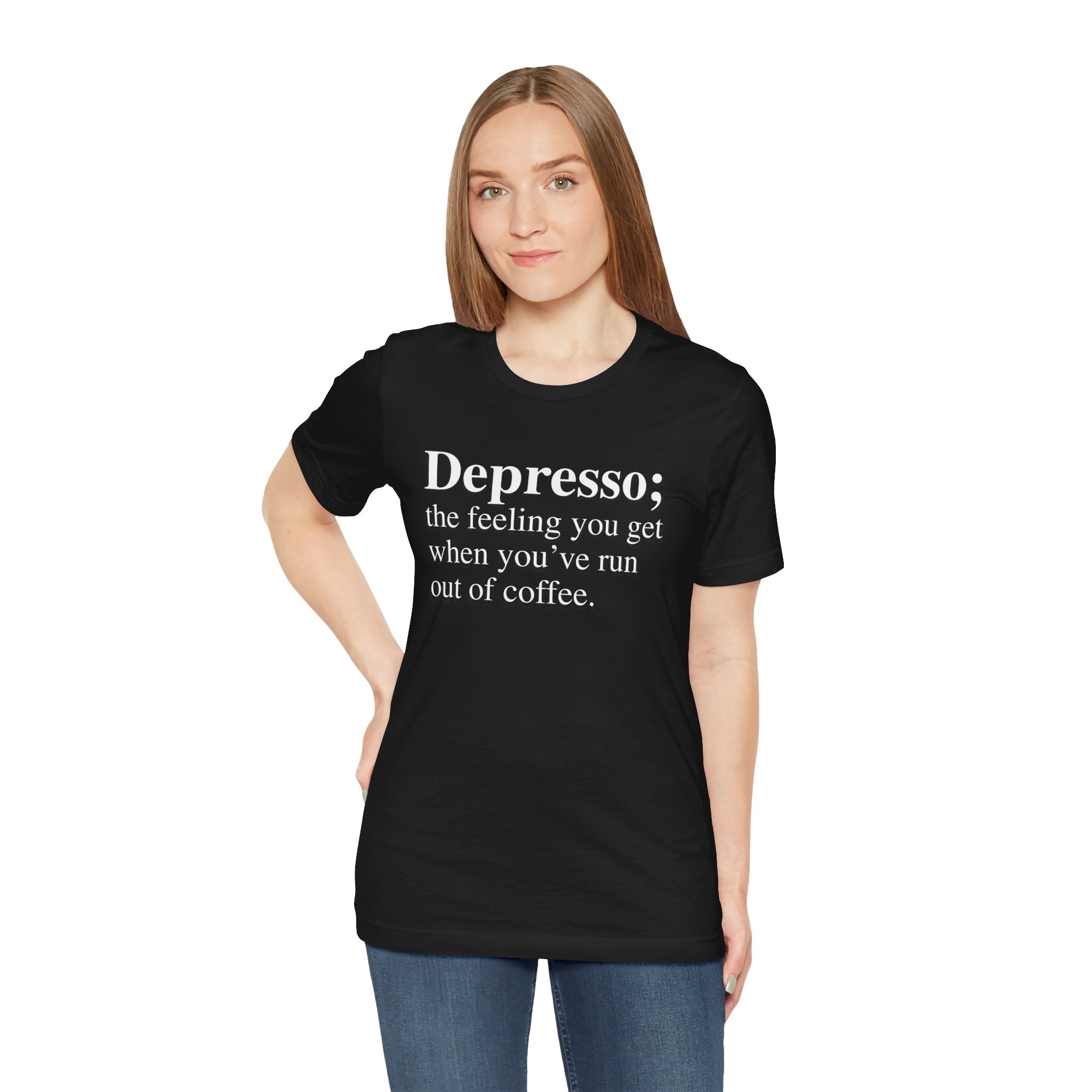 A young woman wearing a soft cotton, black Depresso T-shirt with the text "Depresso; the feeling you get when you’ve run out of coffee.