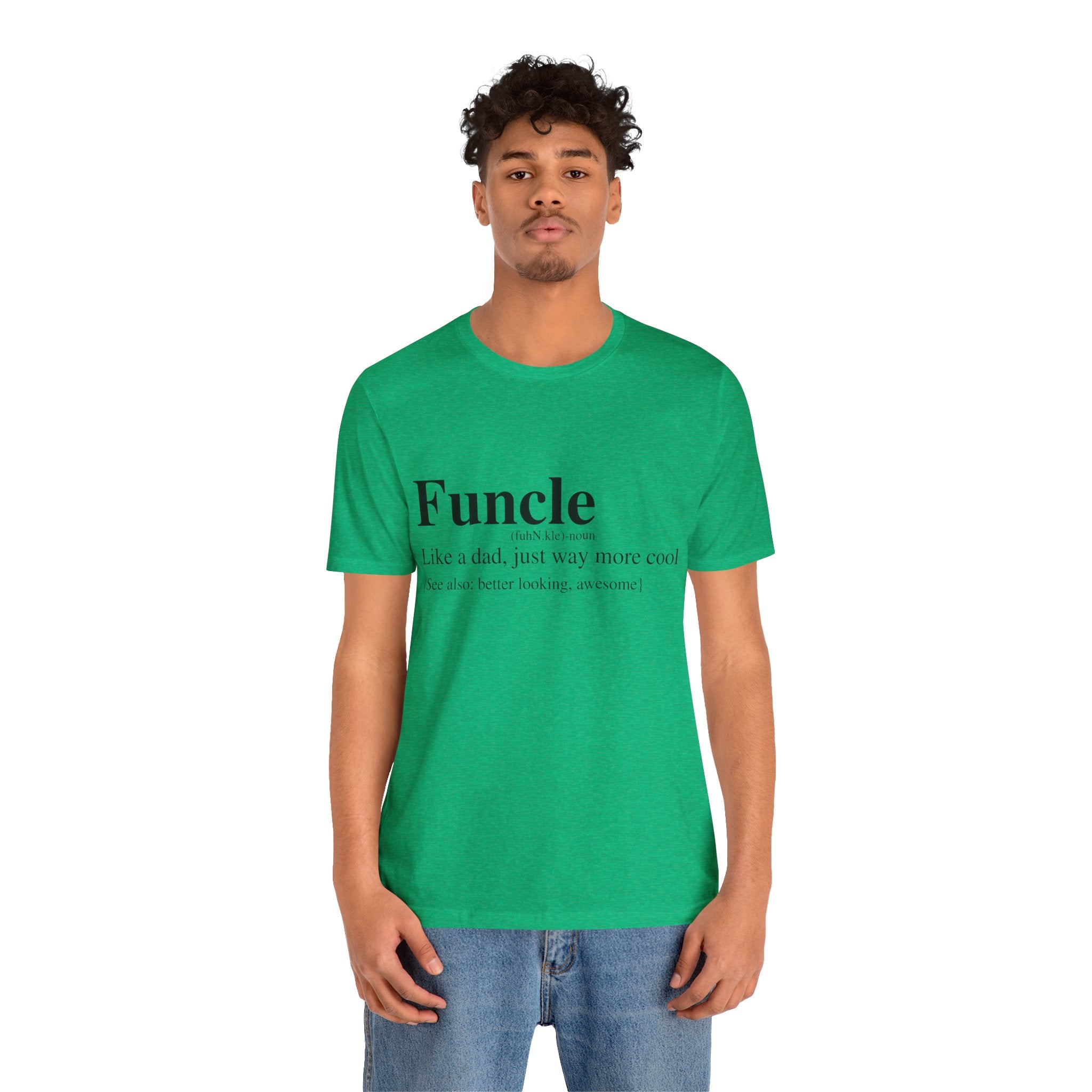 Young man wearing a green Funcle T-Shirt with the text "Funcle - like a dad, just way more cool" printed on it, standing against a plain background.
