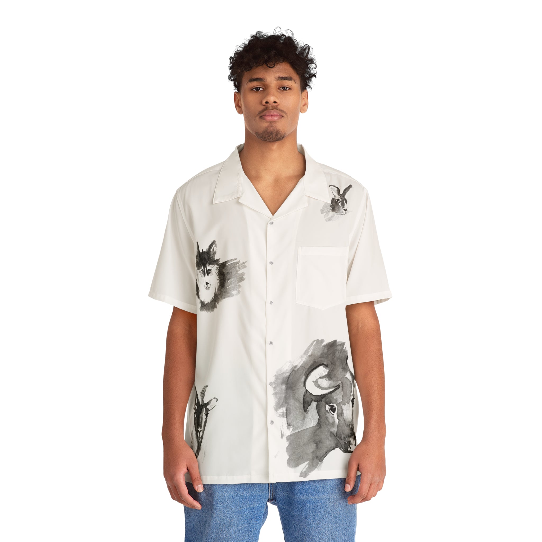 A person is wearing a white short-sleeve t-shirt from the "Oron's Collection LTE - Spirit Animals," featuring animal prints designed by a renowned Oron artist, as they stand facing forward. They pair this unique shirt with stylish blue jeans.