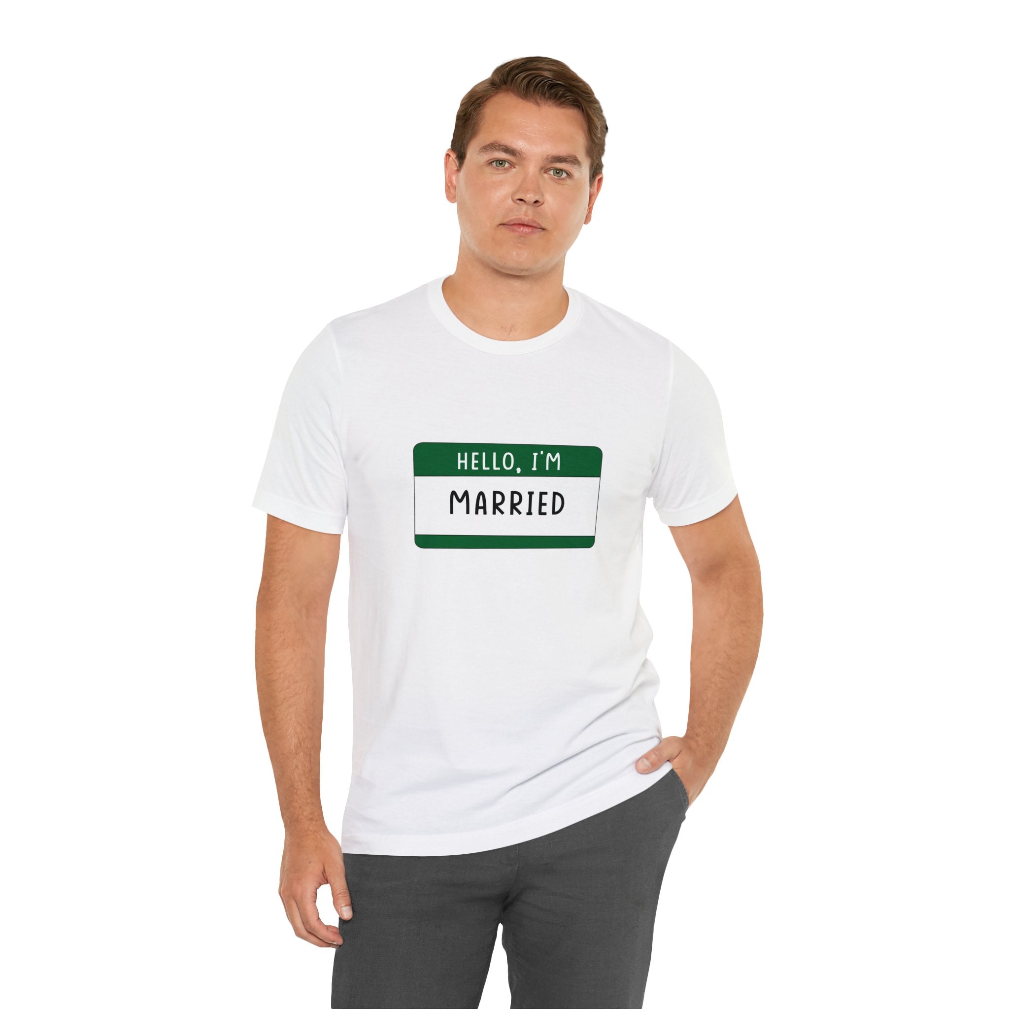 Man in a white Hello, I'm Married T-Shirt with a green name tag standing against a white background.