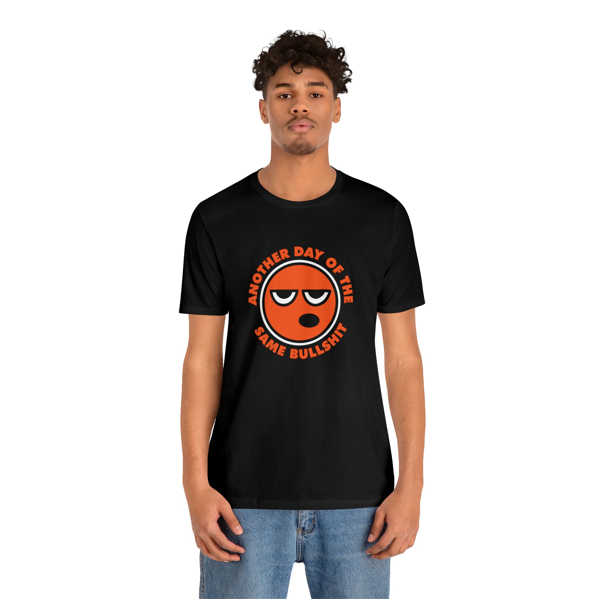 A man in an "Another Day of the Same Bullshit" t-shirt with a cartoon face design.