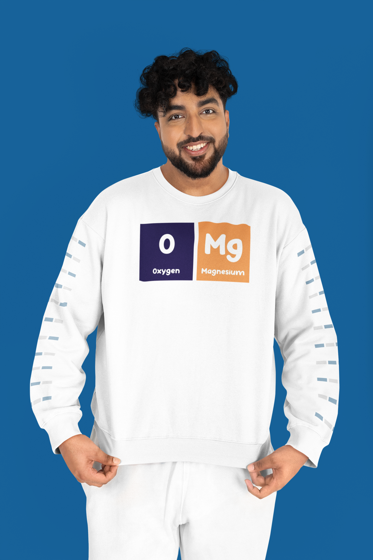 'O-Mg' periodic table sweatshirt in white, man wearing it on a blue background, funny science gift