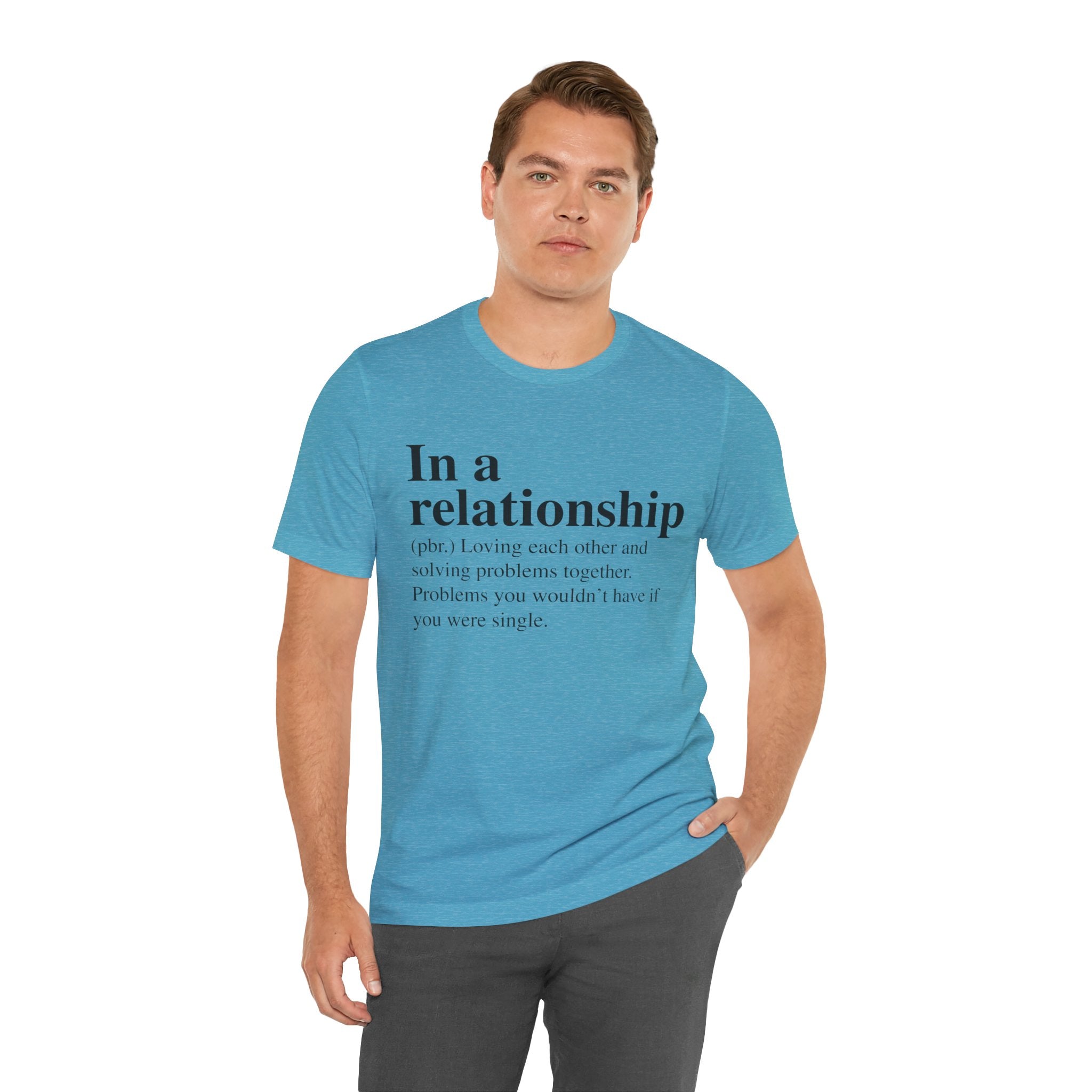 Man in a blue unisex "In a Relationship" tee with the text "solving problems together and problems you wouldn't have if you were single.