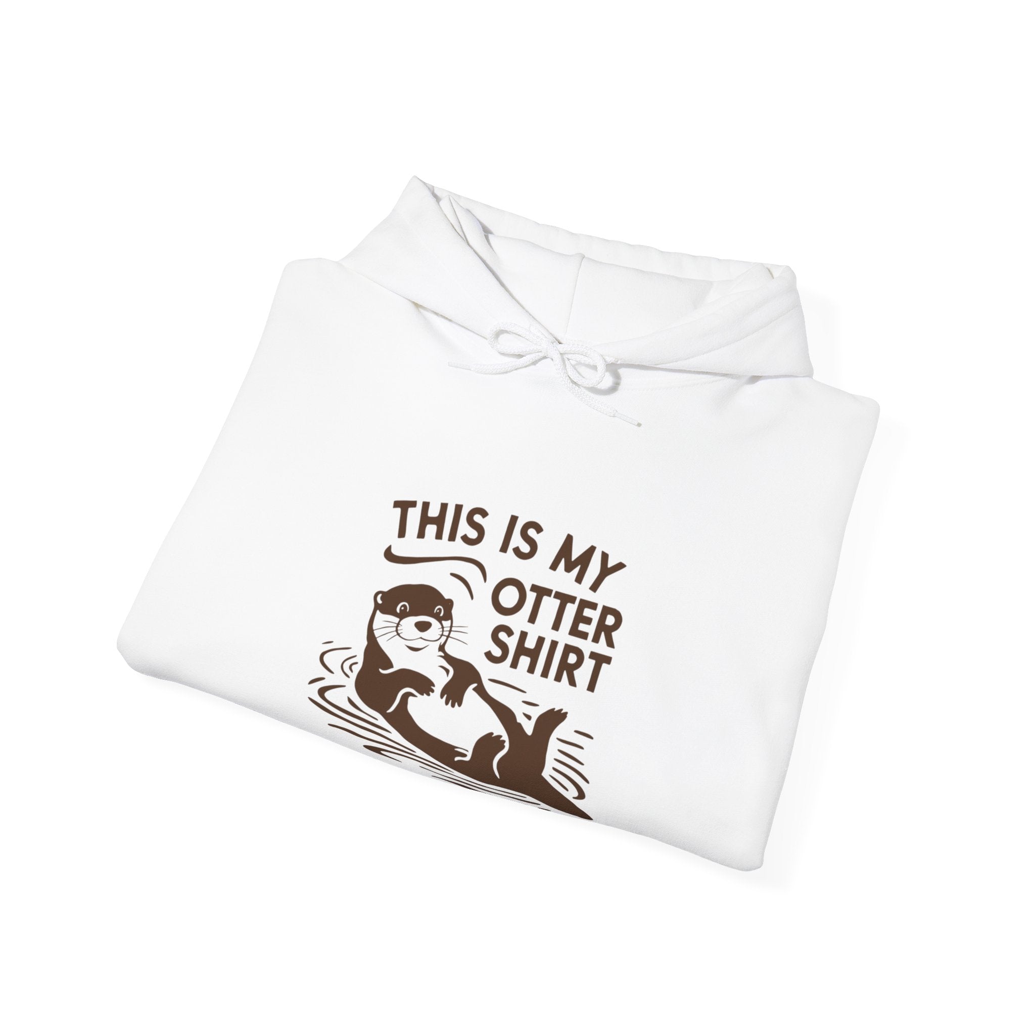 A white My Otter Shirt - Hooded Sweatshirt featuring a graphic of an otter and the text "THIS IS MY OTTER SHIRT" printed in brown, perfect for a cozy interior.