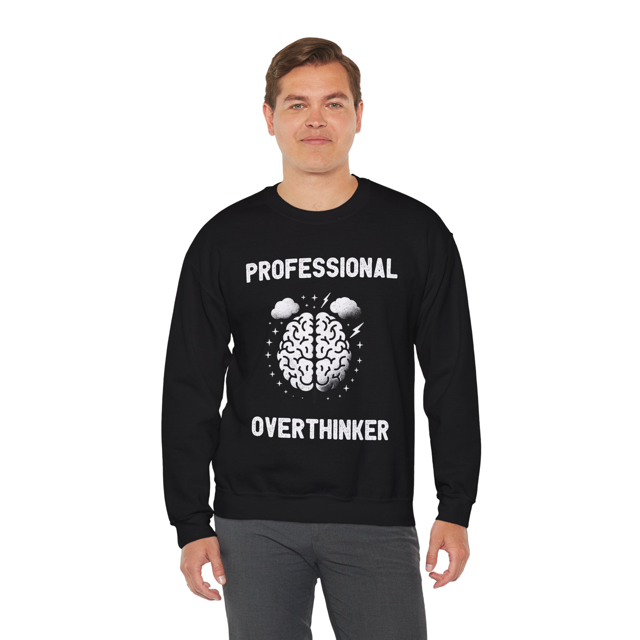 A person wearing a cozy Professional Overthinker - Sweatshirt with the text "PROFESSIONAL OVERTHINKER" and an illustration of a brain with storm clouds, offering warmth for colder months.