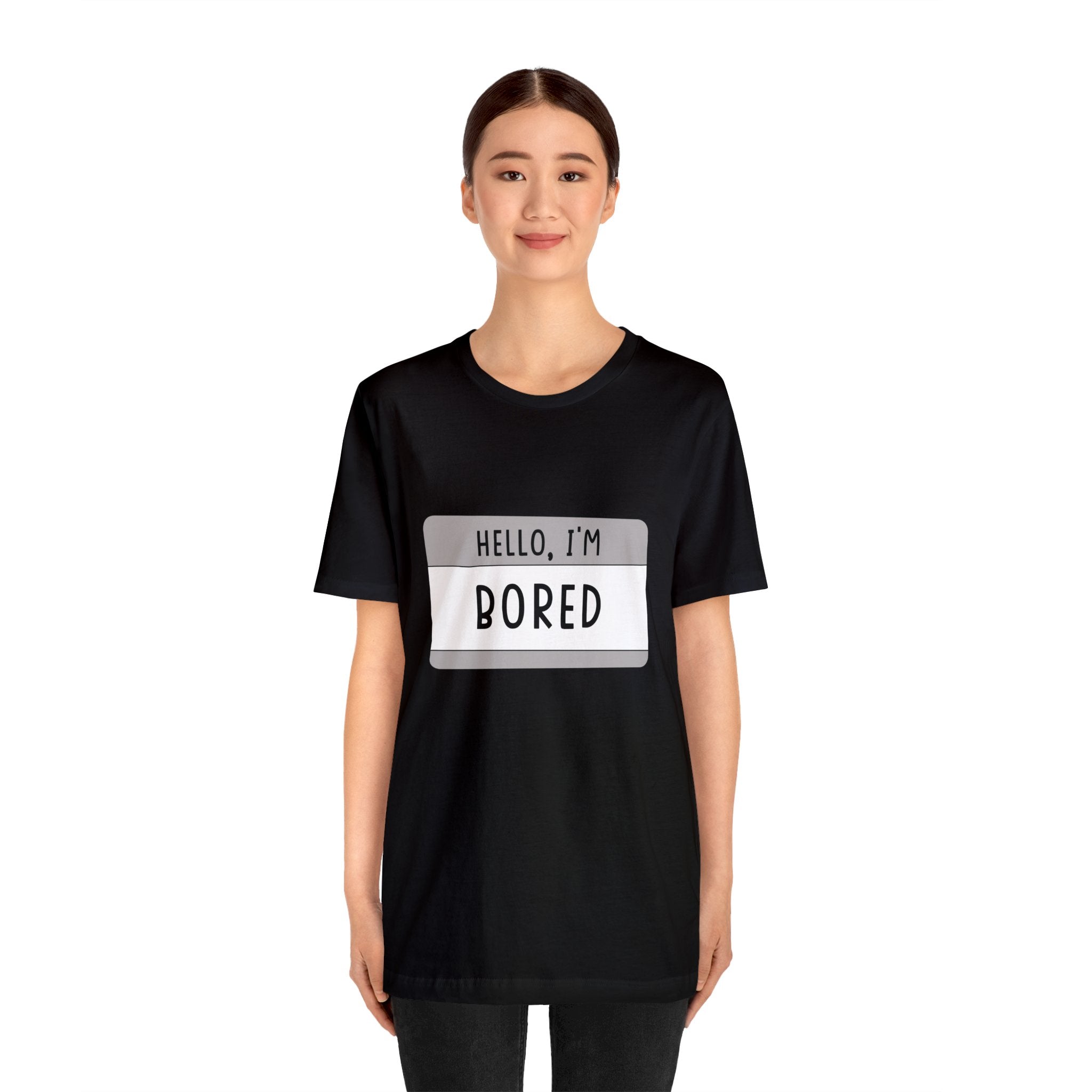 A woman in a black tee-shirt that says "Hello, I'm Board" captures the essence of her laid-back attitude.