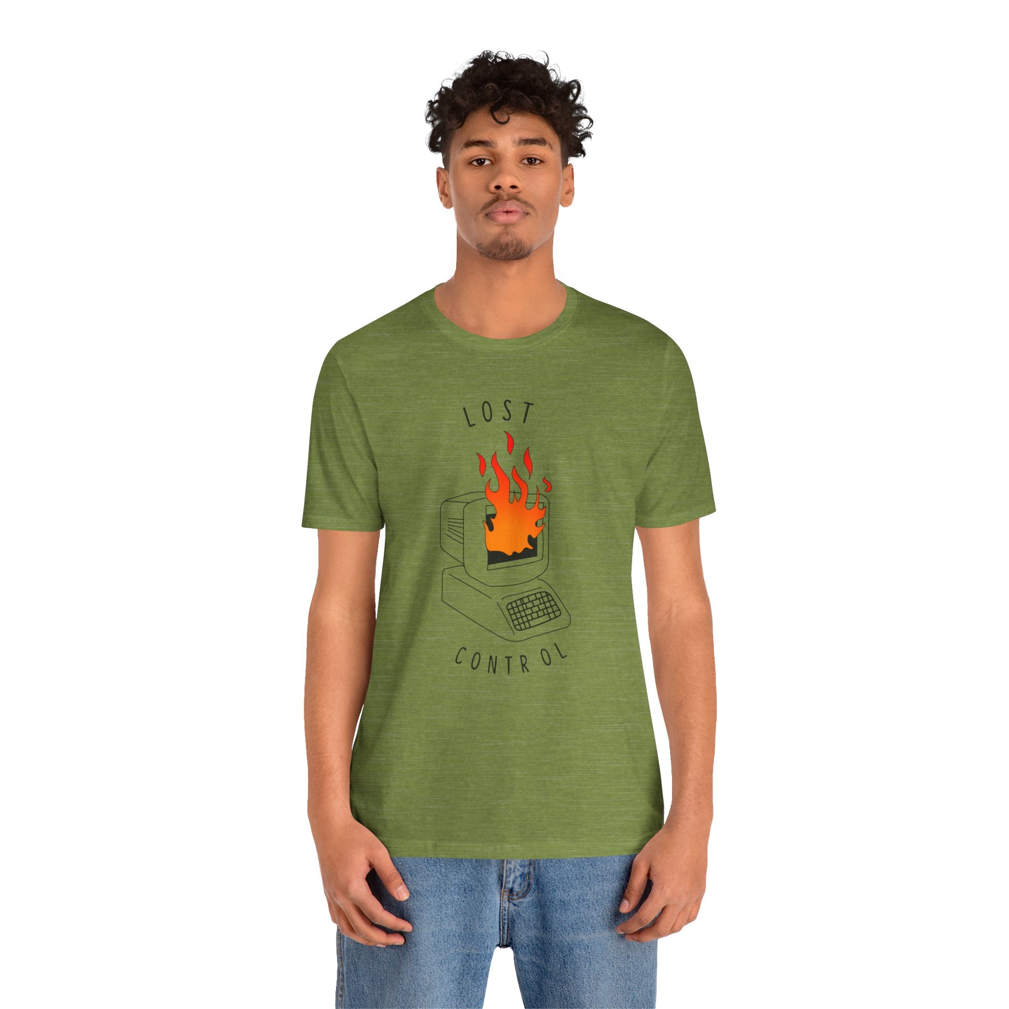 Sporting blue jeans, someone is wearing the bold and comfortable Lost Control T-Shirt, featuring a high-quality cotton in green with a striking graphic of a burning computer and the phrase "Lost Control.