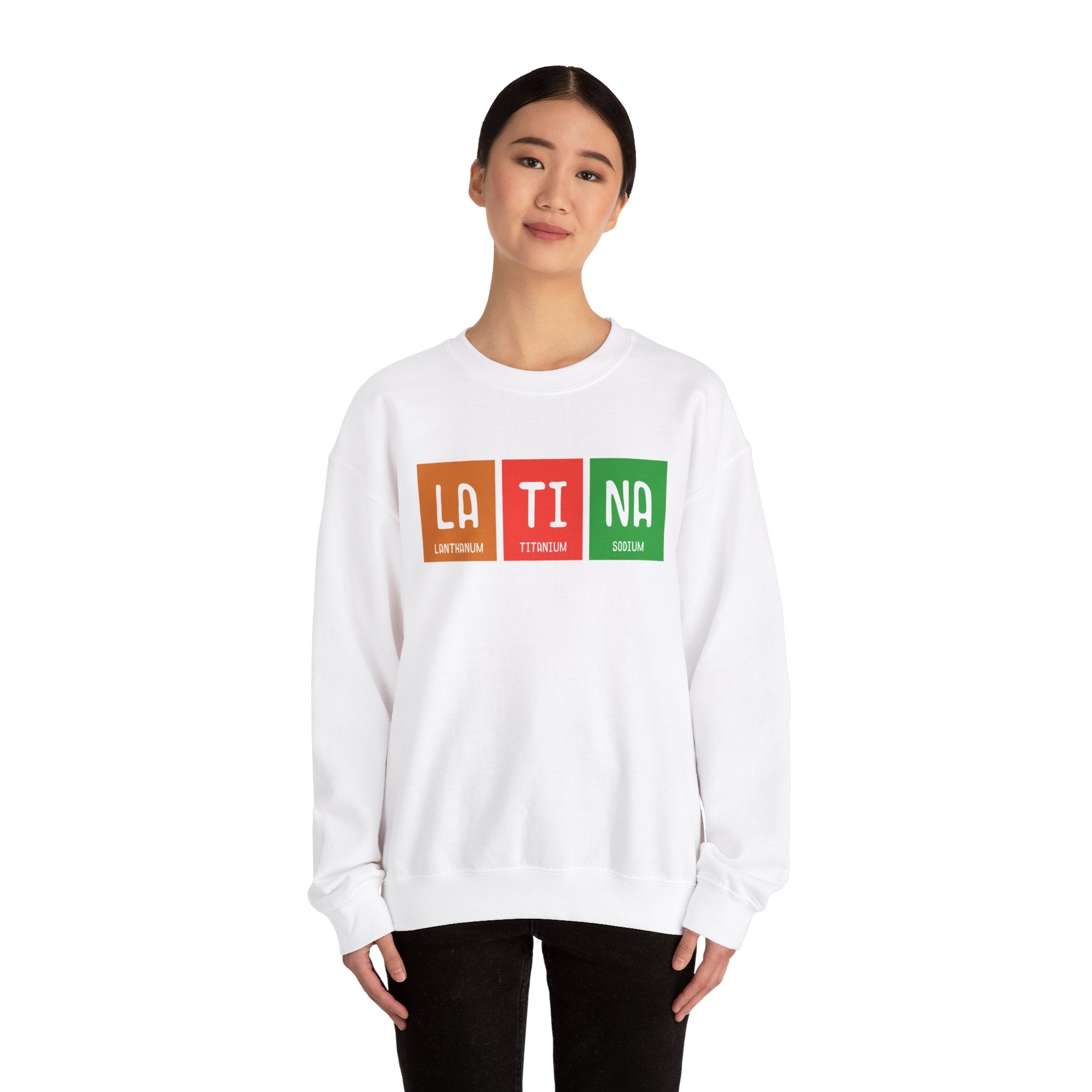 Person wearing a LA-TI-NA - Sweatshirt, a true winter essential, with "LATINA" spelled out using periodic table-style elements in red, orange, and green.