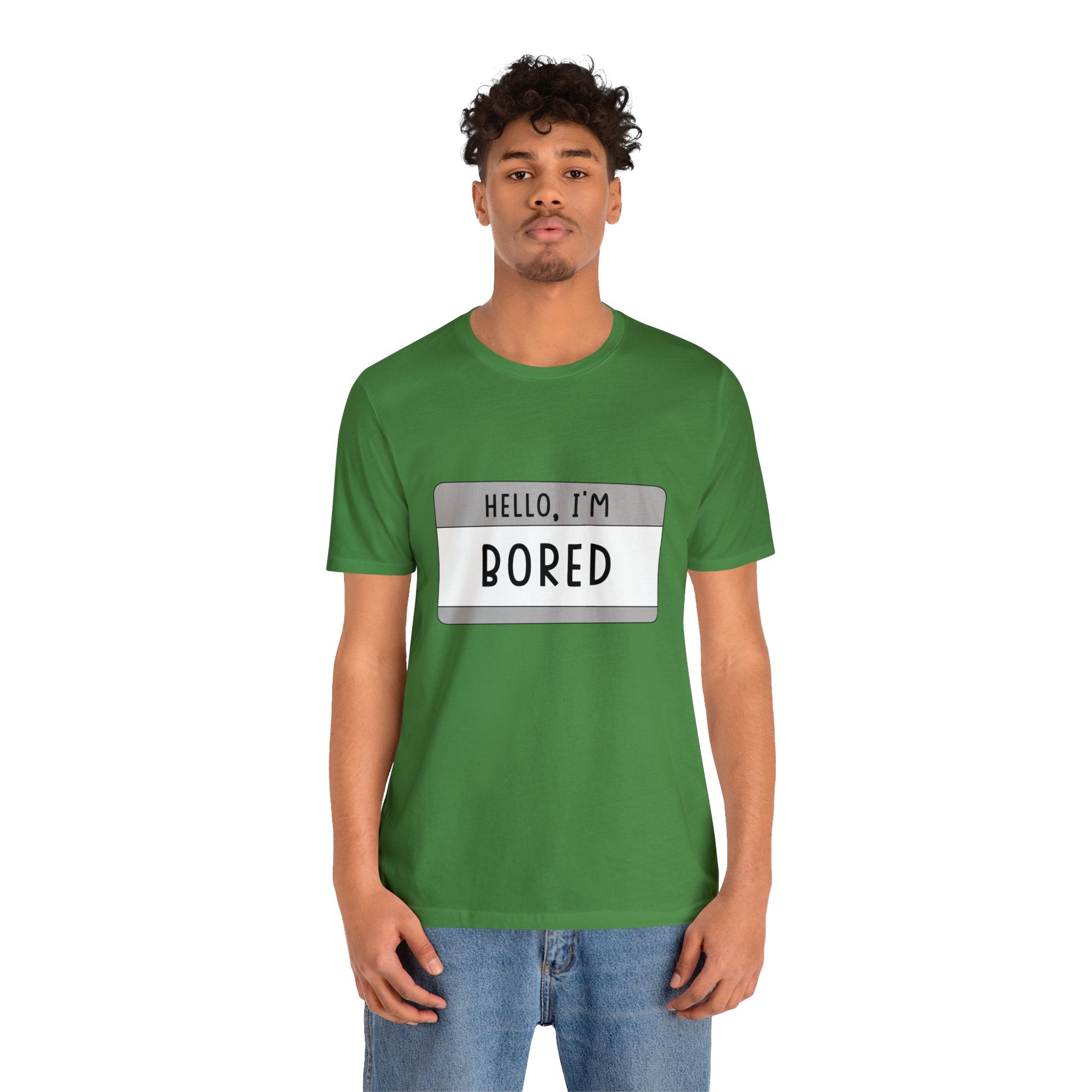 A man in a green tee-shirt reading "Hello, I'm Board T-Shirt".