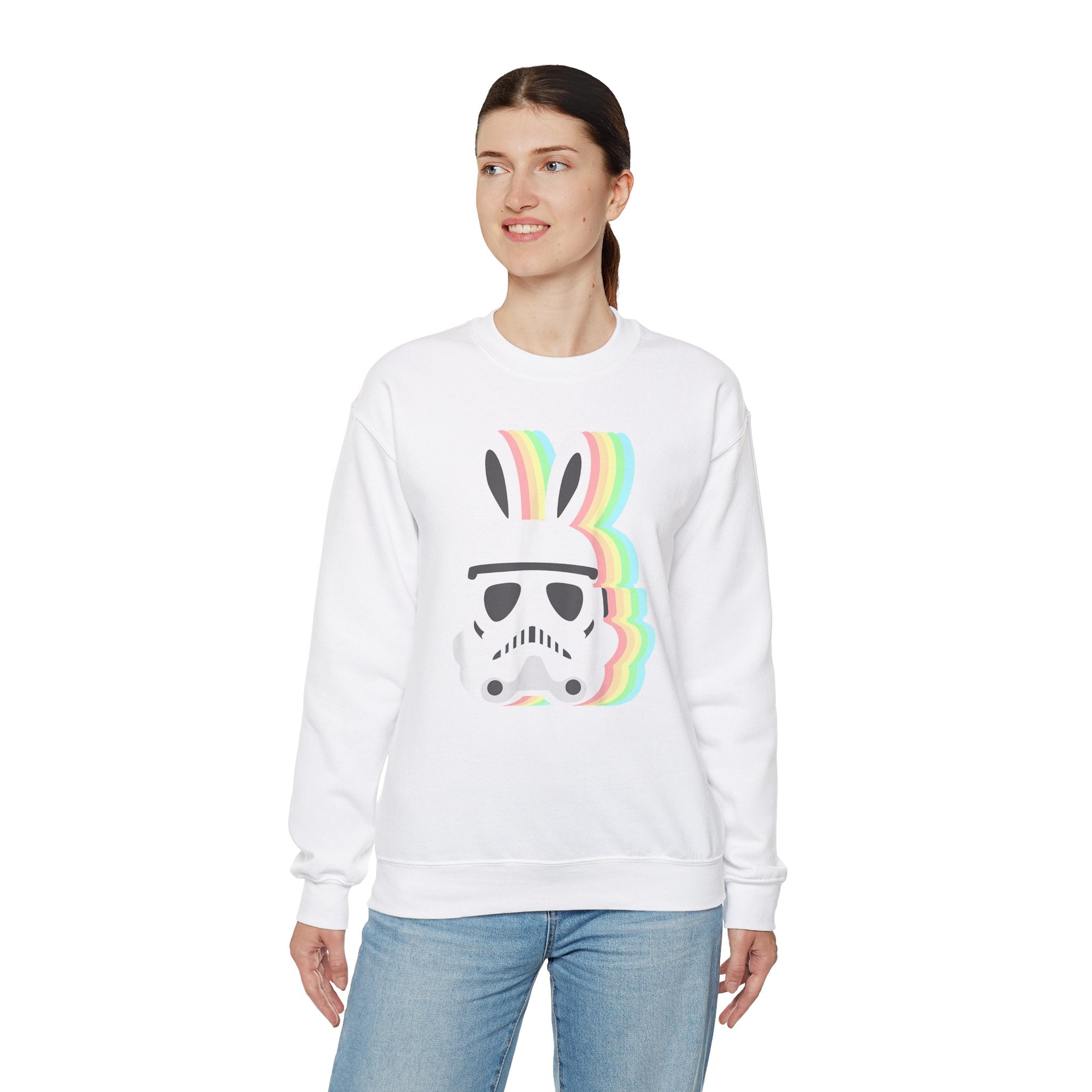 A person wearing a white **Star Wars Easter Stormtrooper - Sweatshirt**, featuring a helmet with bunny ears and a rainbow behind it.