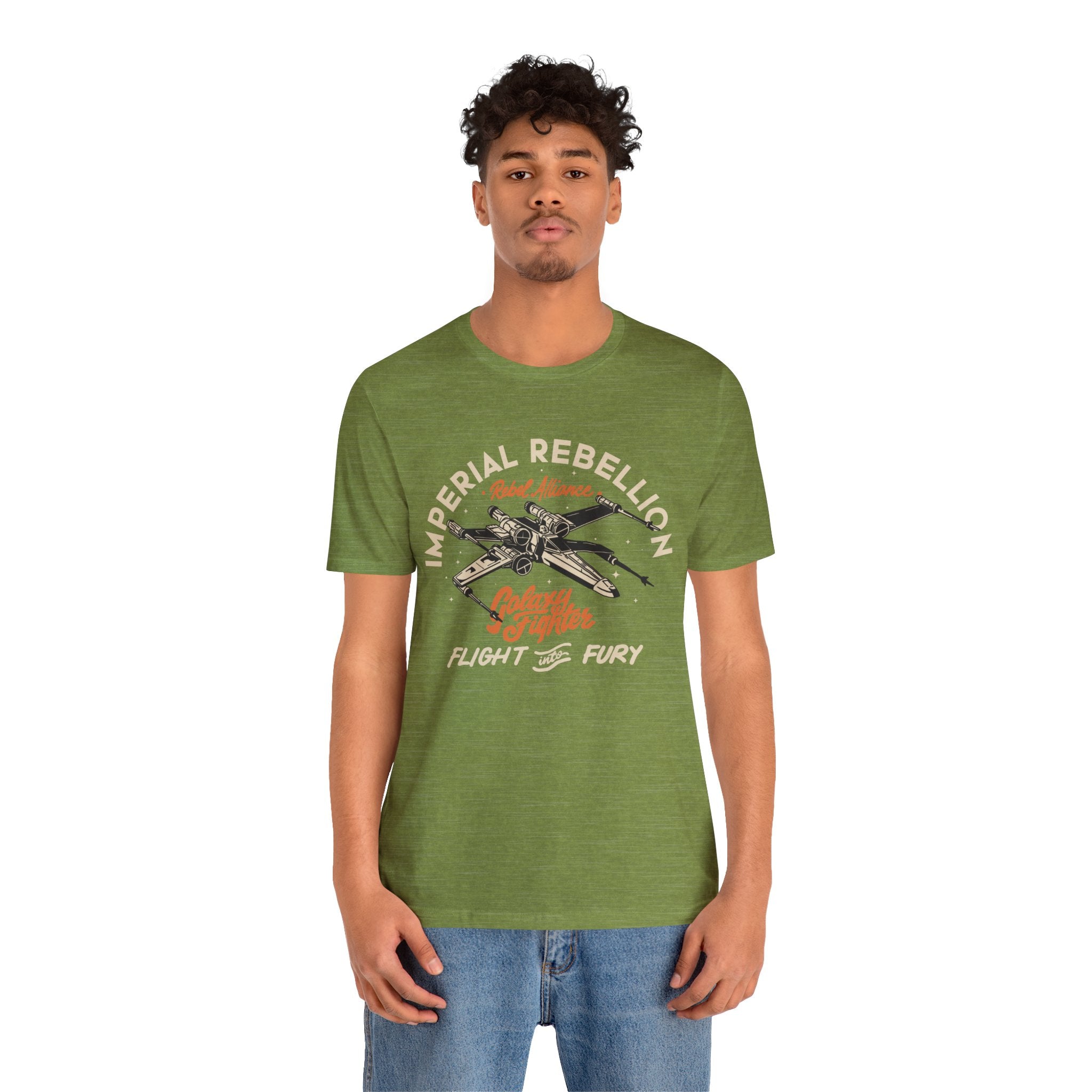 Young man in a green Skywalker T-Shirt with comfortable fit and blue jeans stands facing forward.