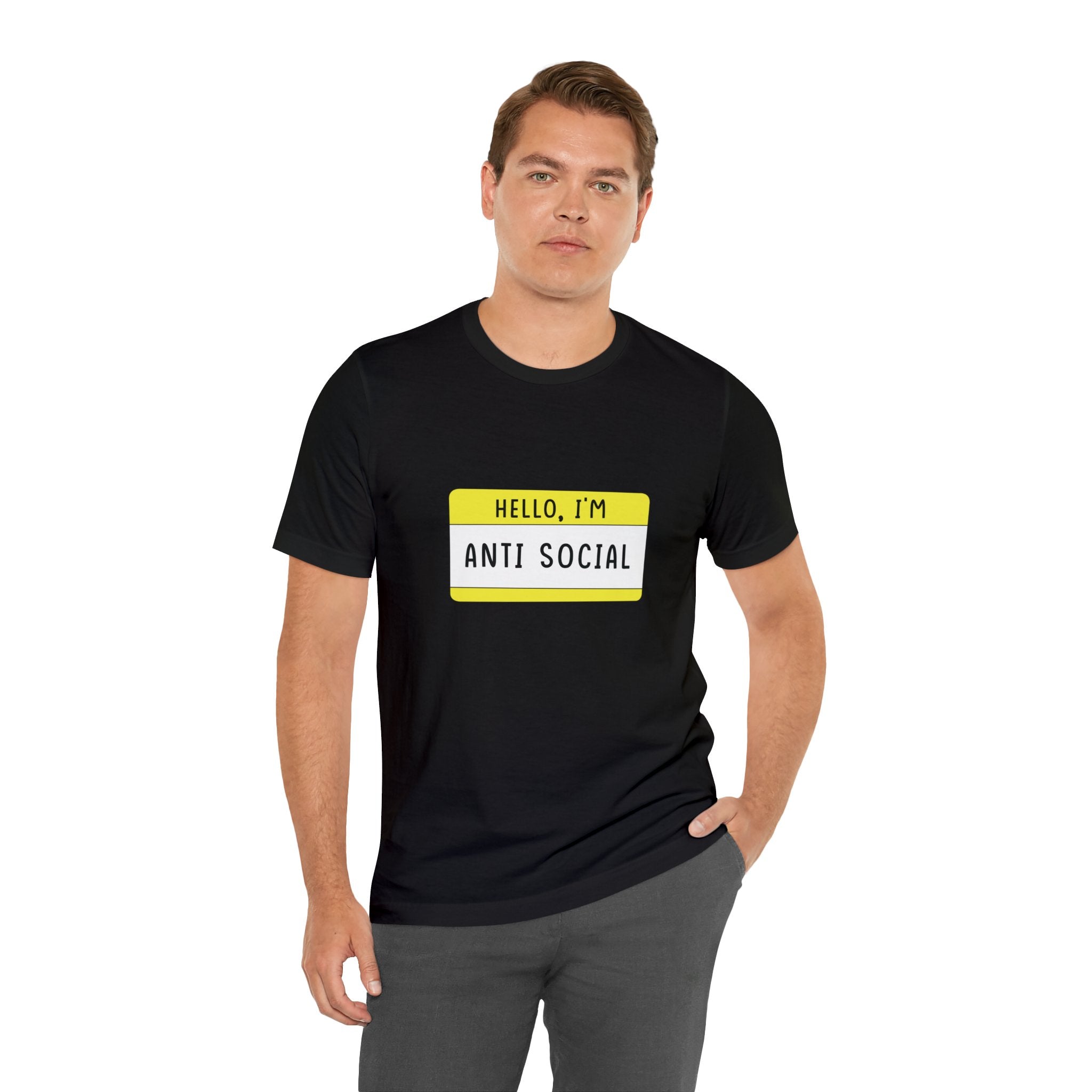 Man standing, wearing a Hello, I'm Anti Social T-Shirt in a yellow name tag design.