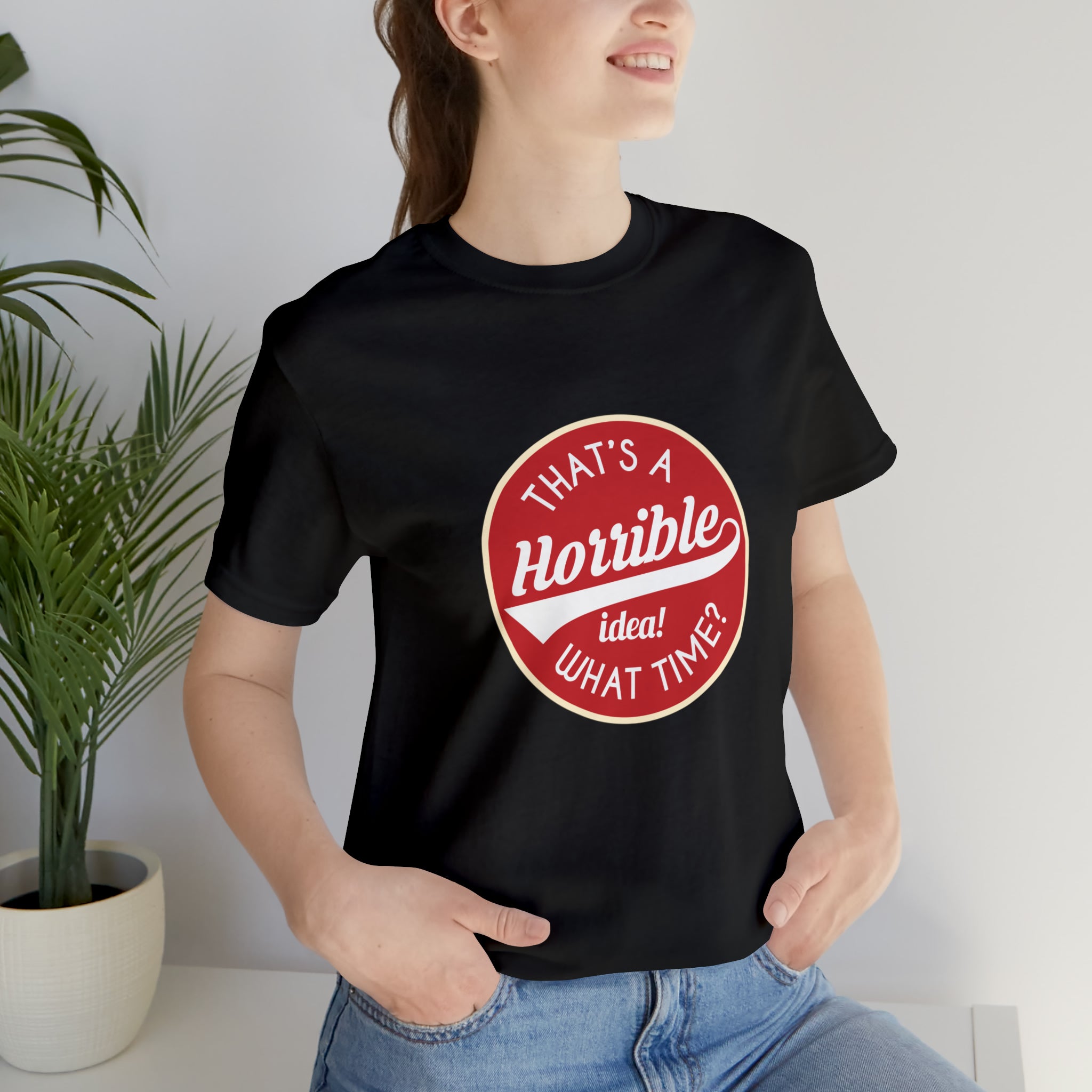 A woman wearing a black That's a horrible idea - what time T-Shirt.