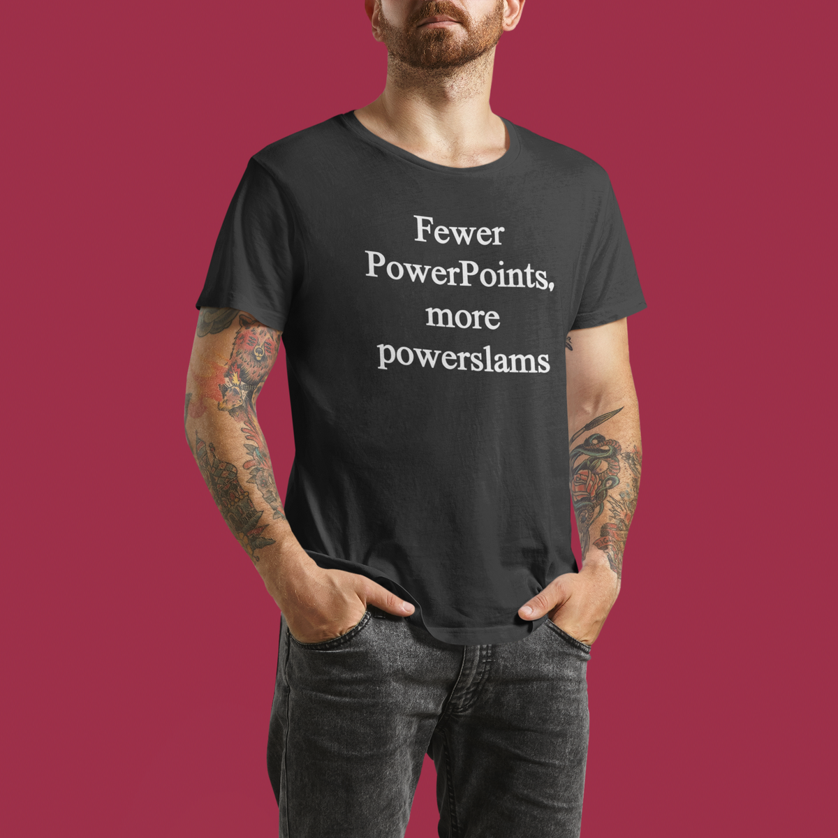 'Fewer PowerPoints More Powerslams' t-shirt in black, man modeling it on maroon background, funny gift