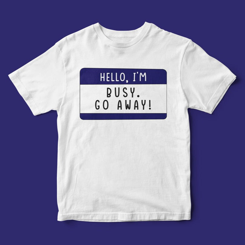 Hello, I'm Busy Go Away T-Shirt with a blue name tag graphic on a purple background, perfect for those seeking alone time.