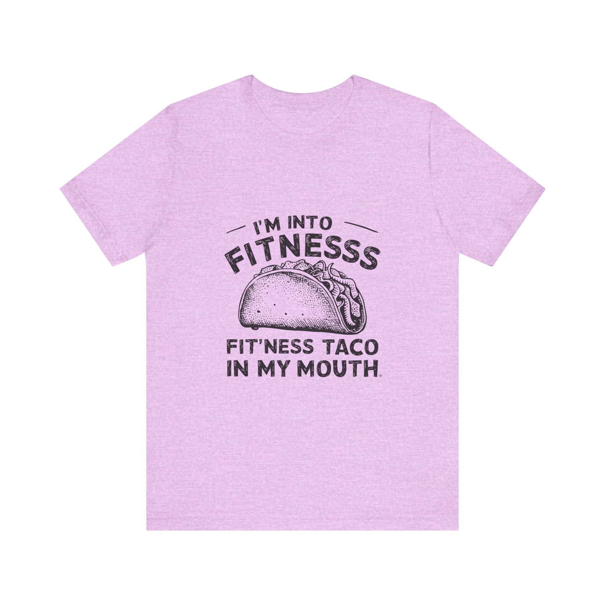 The "I'm into Fitness - T-Shirt" in purple is made from soft Airlume combed ring-spun cotton and showcases the humorous text "I'm into fitness, fit'ness taco in my mouth" with a cute taco illustration. It's ideal for taco lovers who appreciate a blend of humor and comfort.