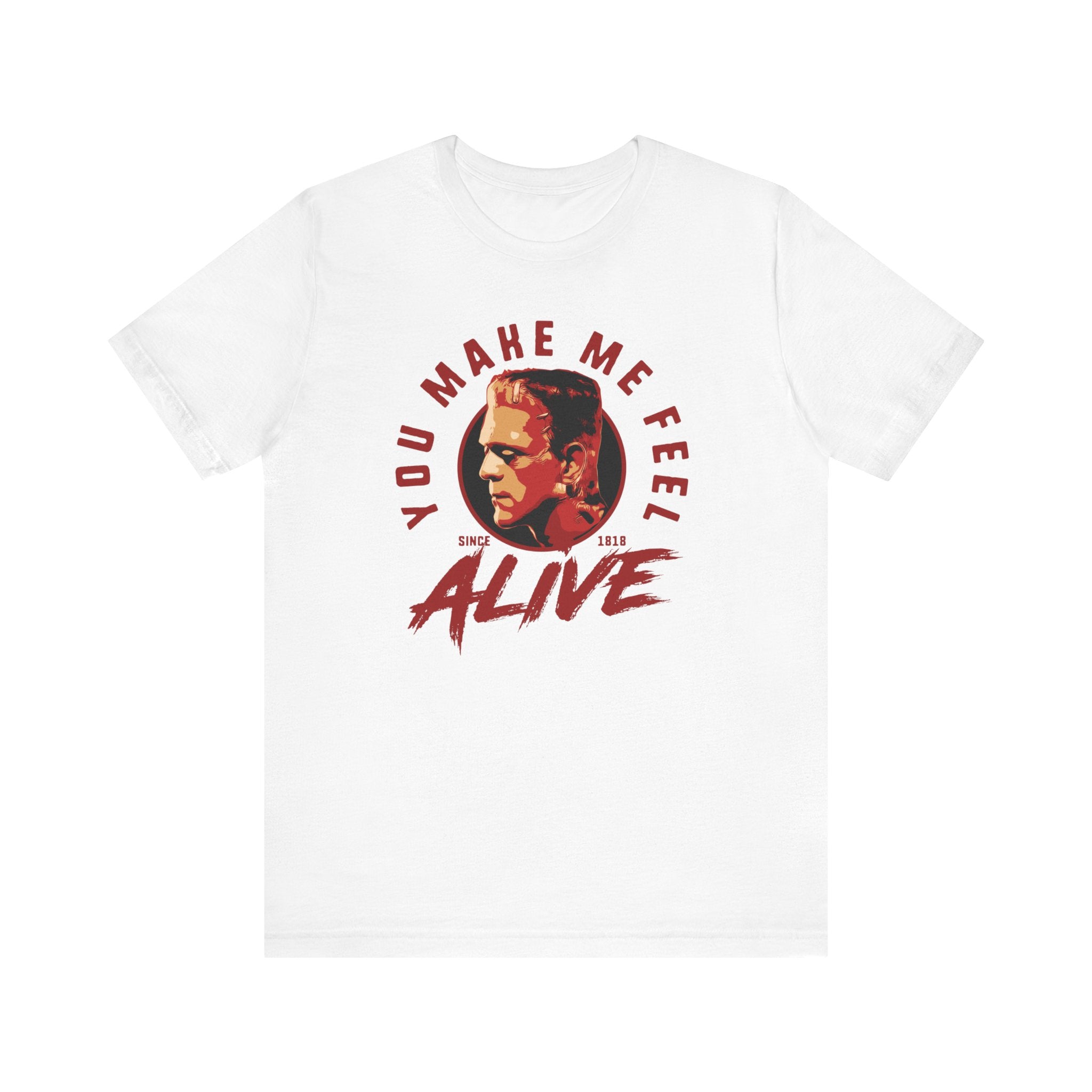 White t-shirt featuring a quality print of a man's face with the text "You Make Me Feel Alive" in red and black font.