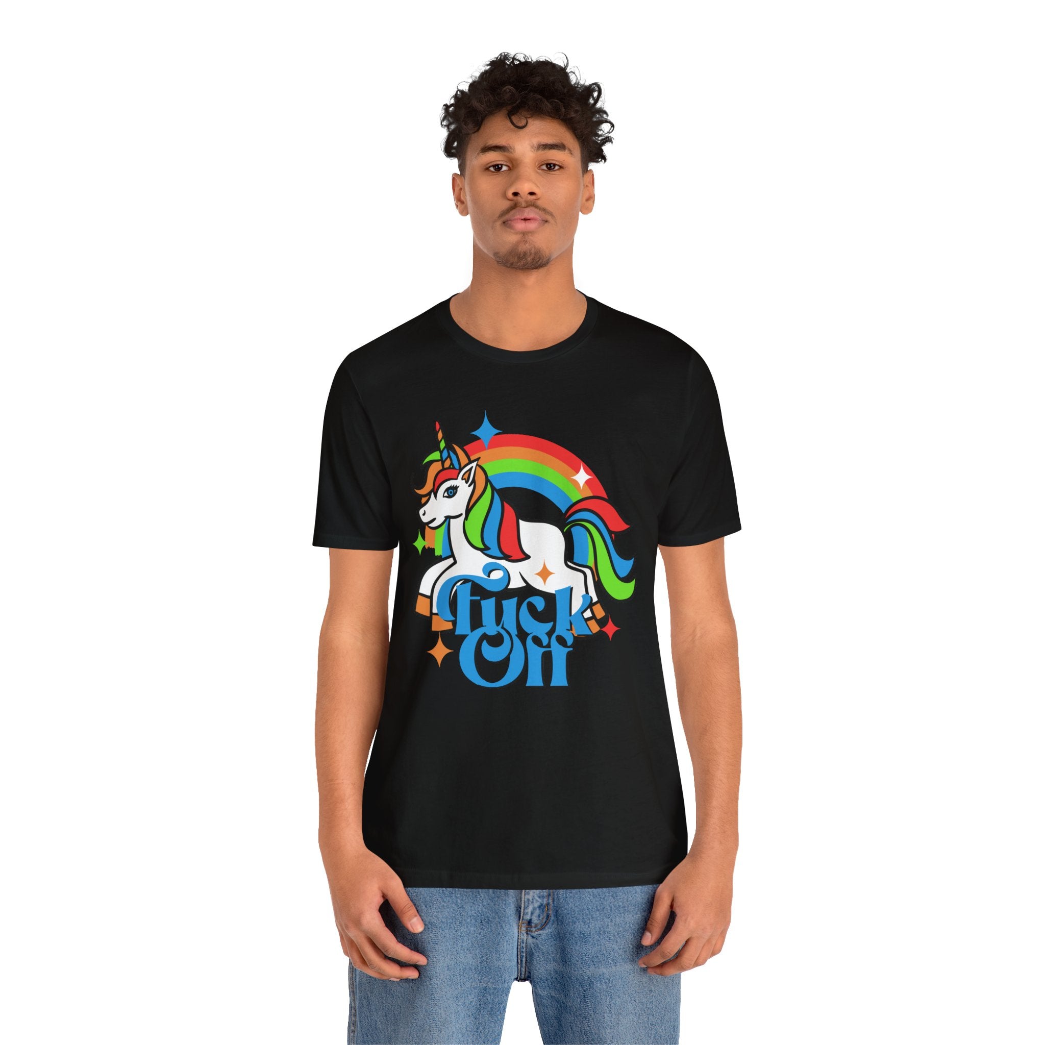 A man wearing a black F off T-shirt with a colorful unicorn and rainbow design printed on it.