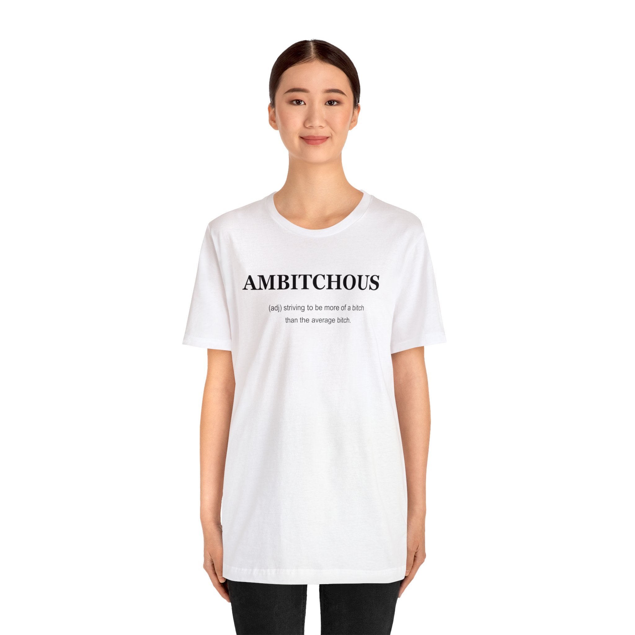 An empowering woman in a white Ambitchious T-shirt proudly displaying the word "Ambitchious".