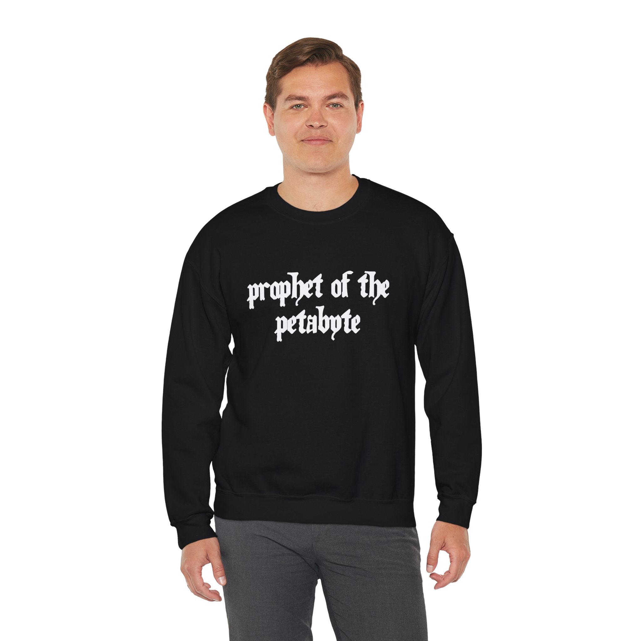 The individual is sporting a comfortable, stylishly modern black "Prophet of the Petabyte" sweatshirt.