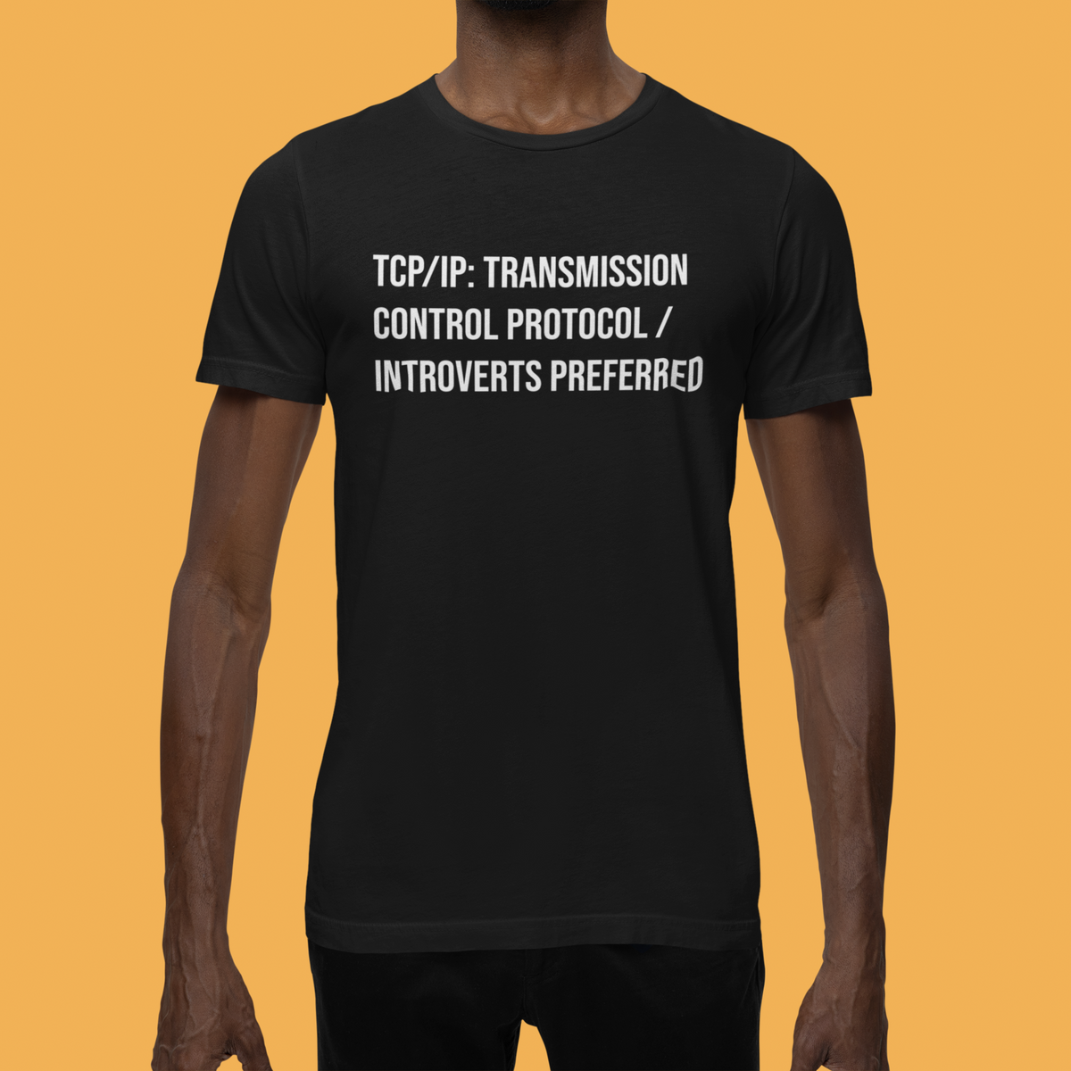 'TCP/IP Transmission Control Protocol Introverts Preferred' tee in black, close up on a man against orange, IT gift