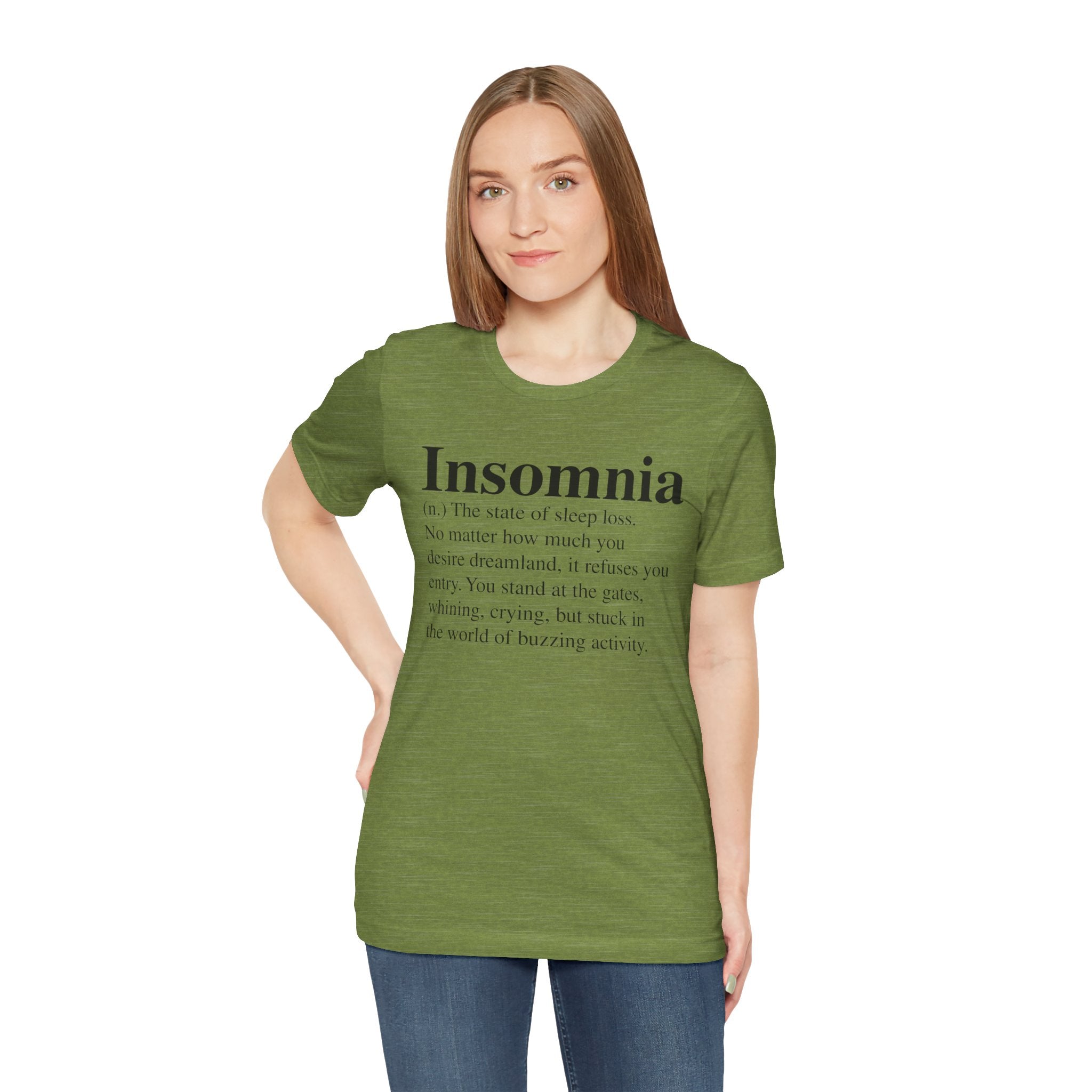 A woman with long brown hair wearing a green, soft cotton Insomnia T-Shirt with the word "insomnia" and a related text printed on it.