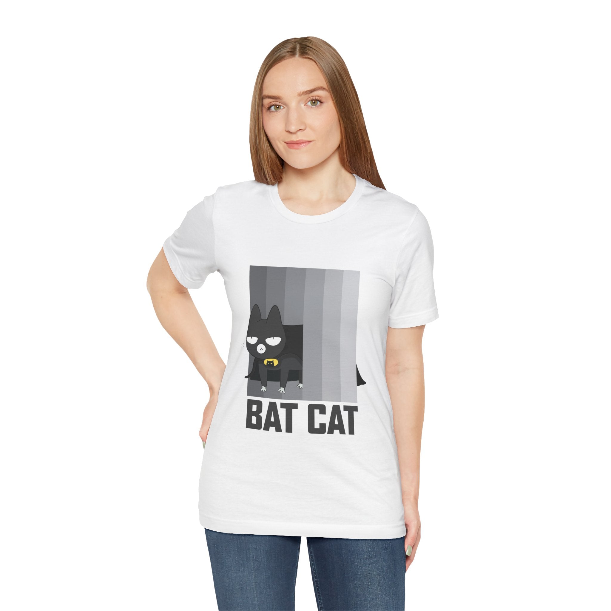 Woman in a white BATCAT T-Shirt featuring a cartoon "Batcat" design.