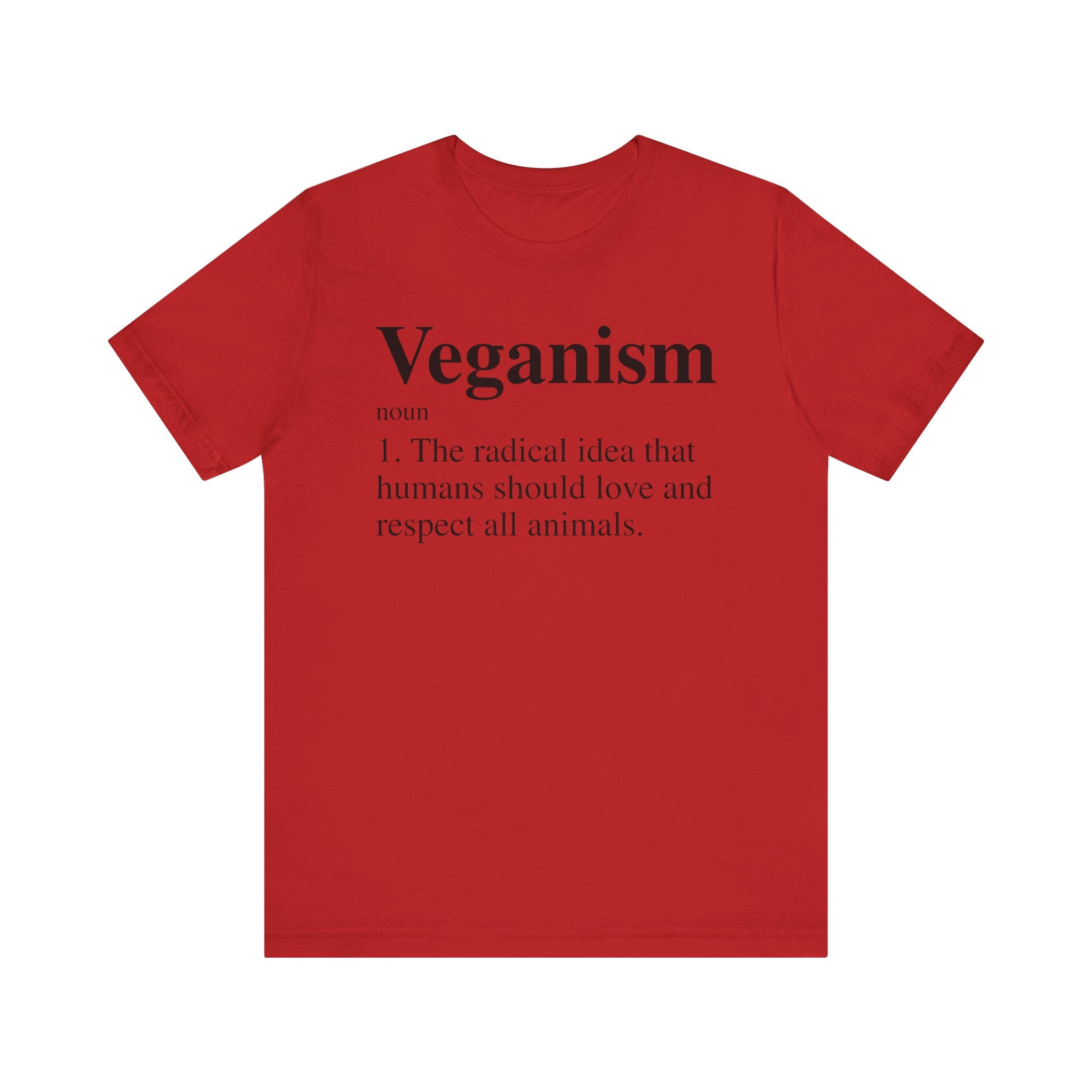 Unisex red Veganism T-Shirt with a definition of "veganism" printed on the front in white text.