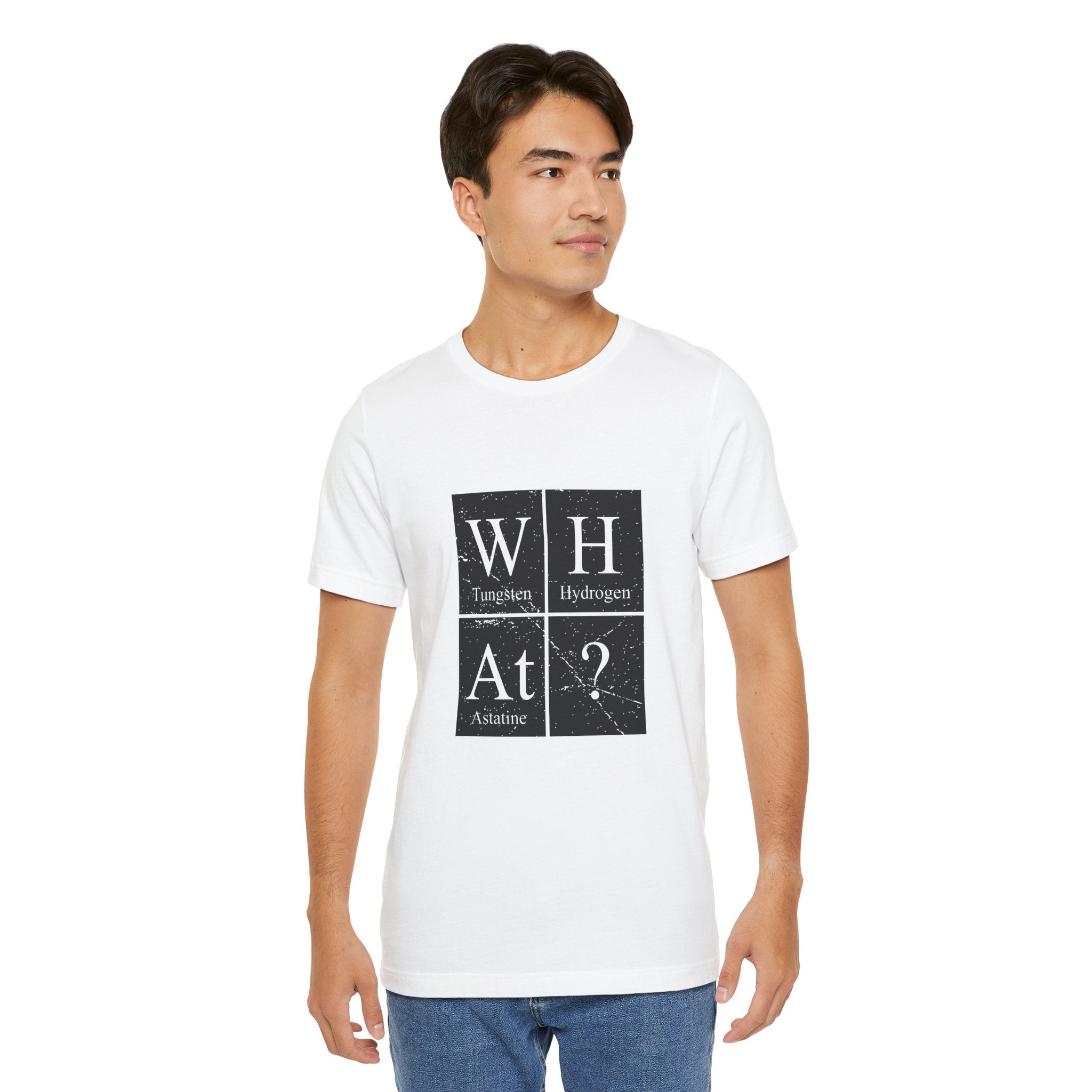 Young man in a white unisex jersey tee with a periodic table design featuring the elements W-H-At-?