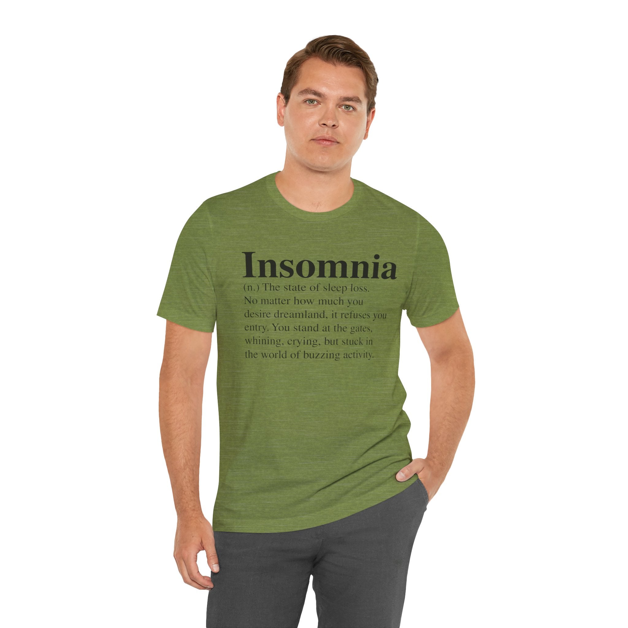 Man in an Insomnia T-Shirt, standing with one hand on his hip.