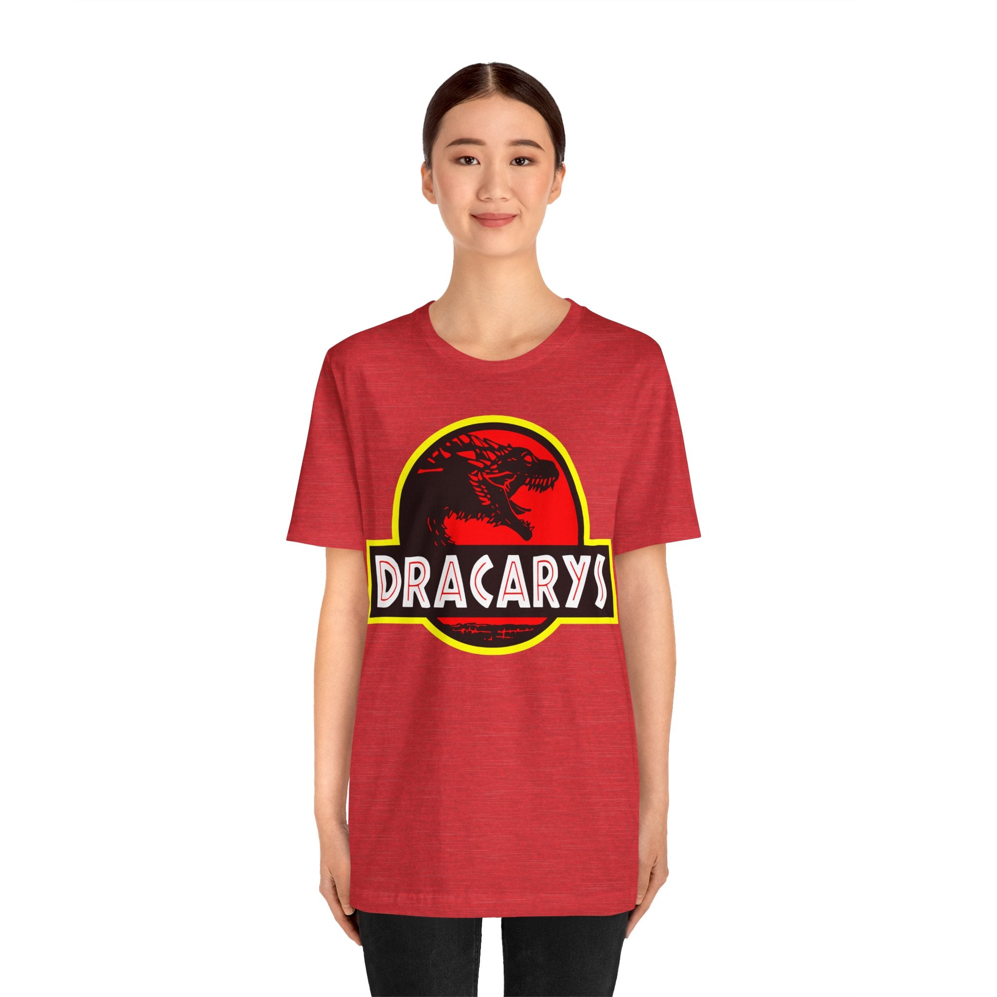 A young woman wearing a red Dracarys T-Shirt with a dragon emblem design stands facing forward.