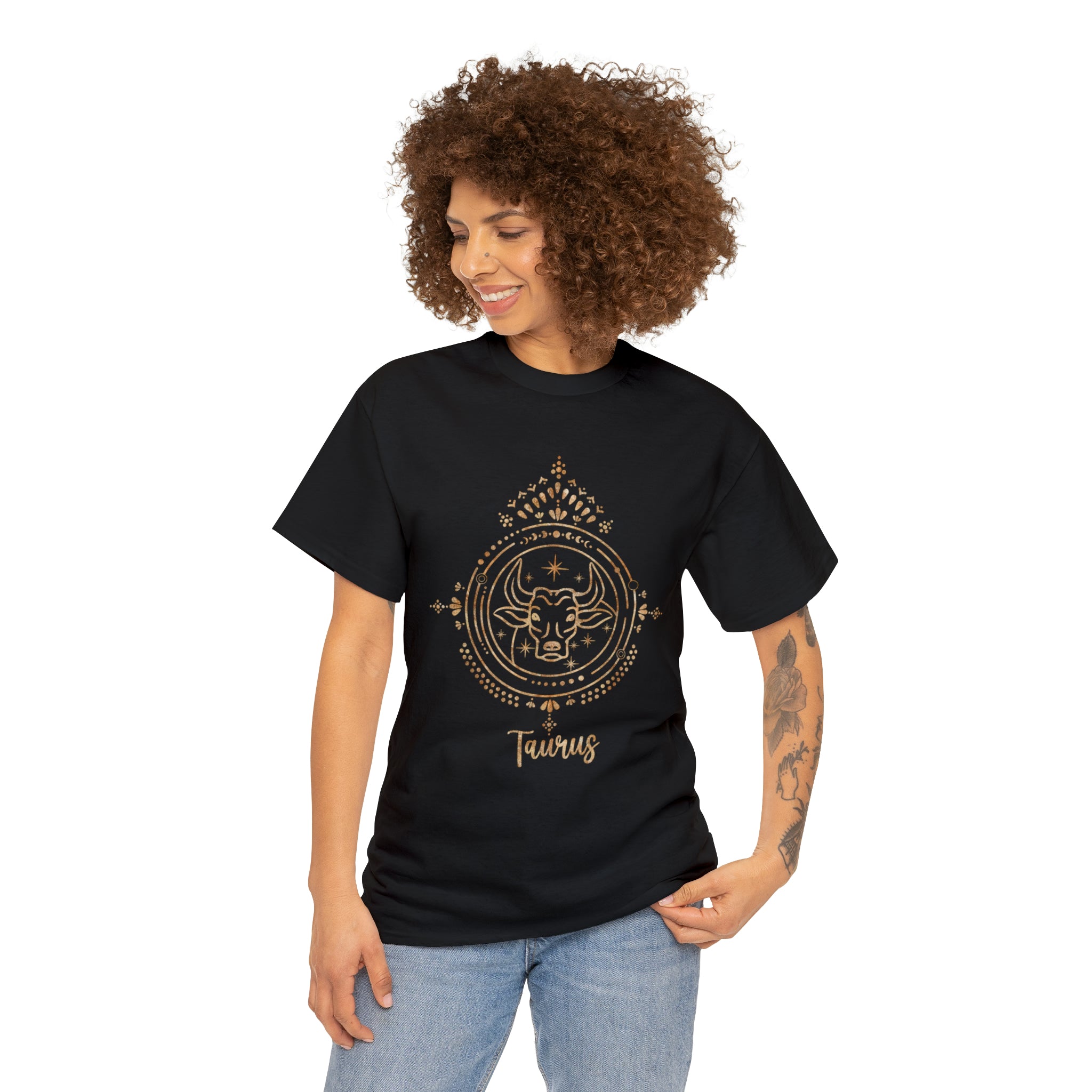 A woman with a steadfast and pleasure-seeking Taurus personality, wearing a black Tauruses t-shirt with a gold design.