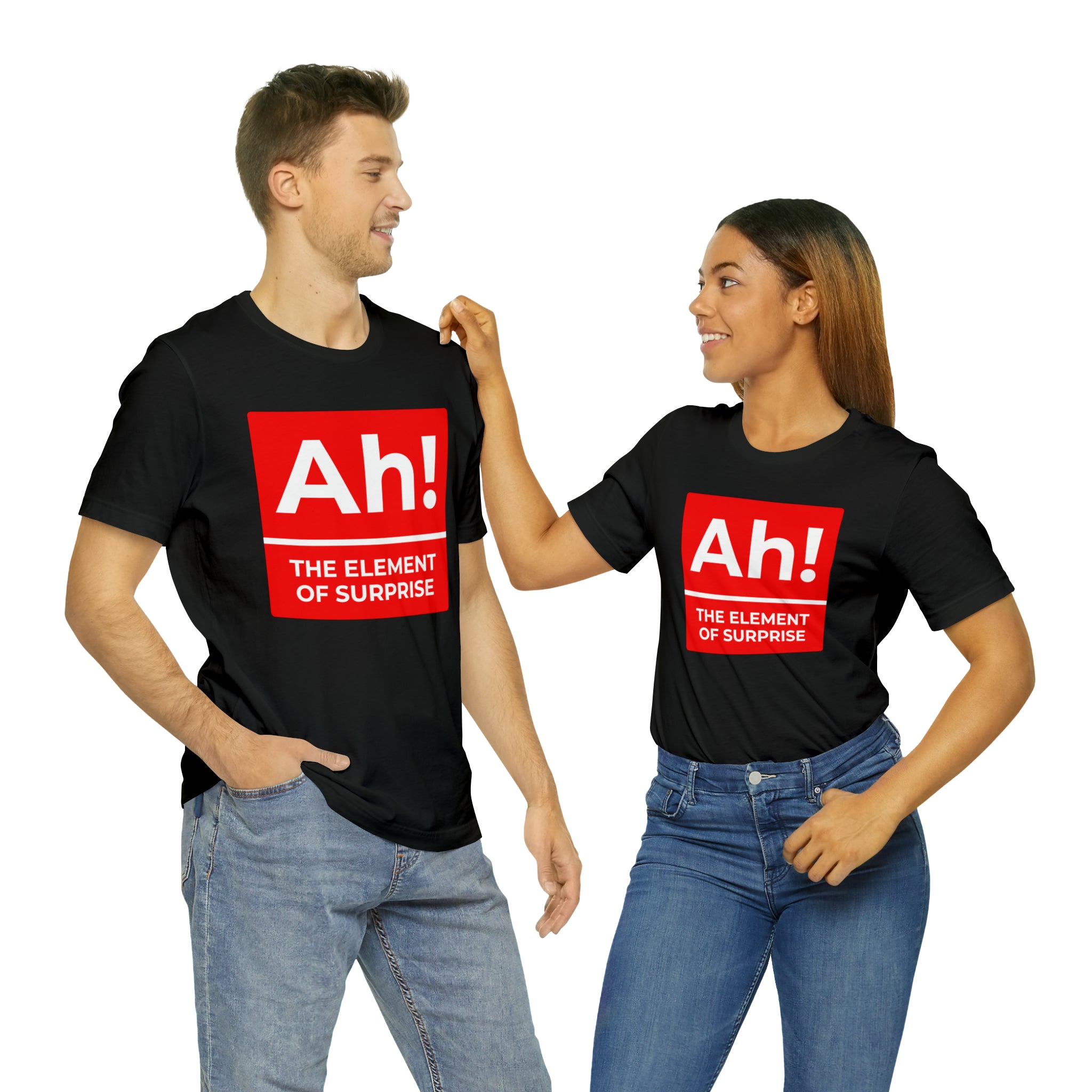 A man and woman standing next to each other wearing an Ah! the Element of Surprise T-shirt, showcasing their chemistry.
