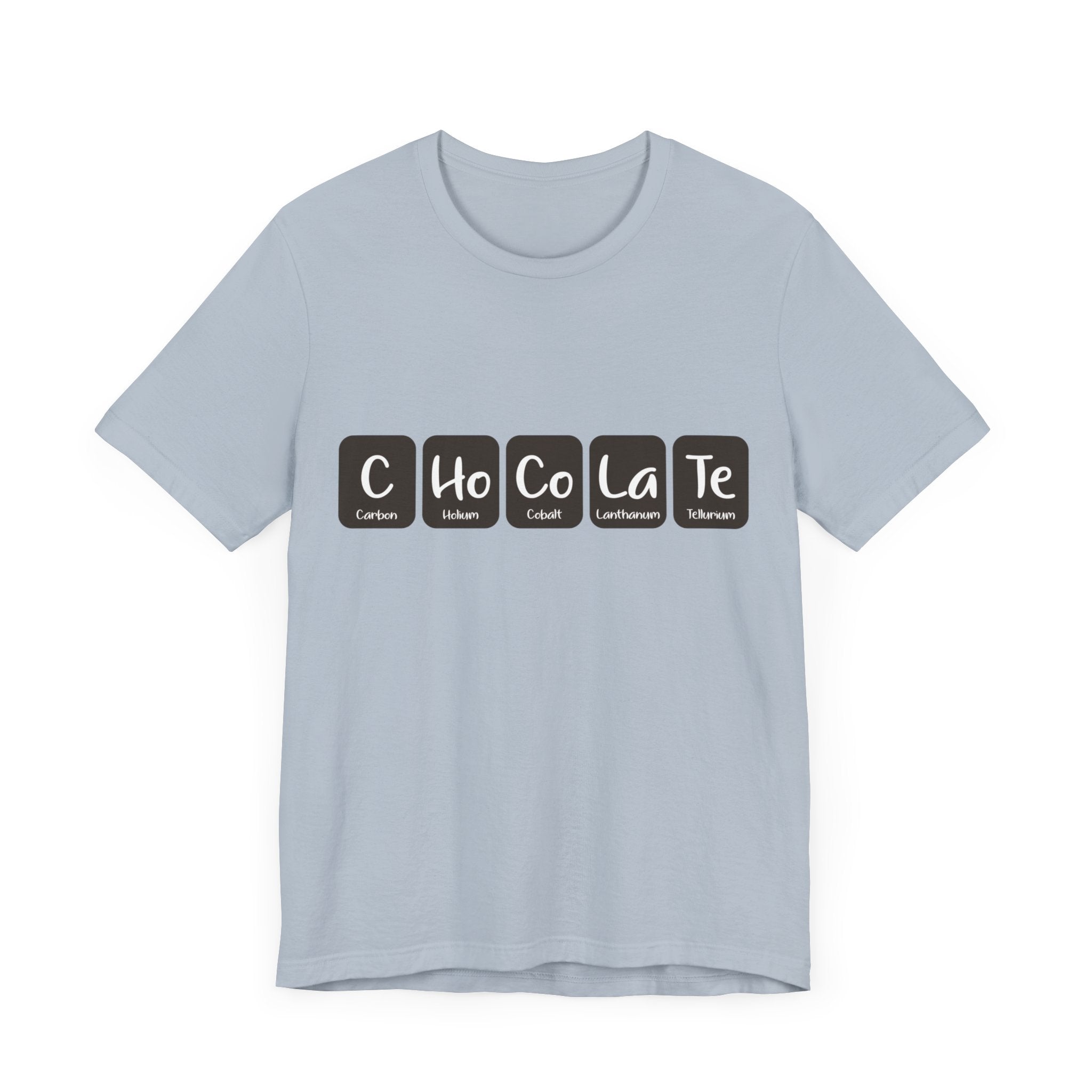 A light blue C-Ho-Co-La-Te - T-Shirt featuring a design with the word "Chocolate" spelled out using periodic table elements. Made from 100% Airlume cotton, this fashionable tee offers both comfort and style.