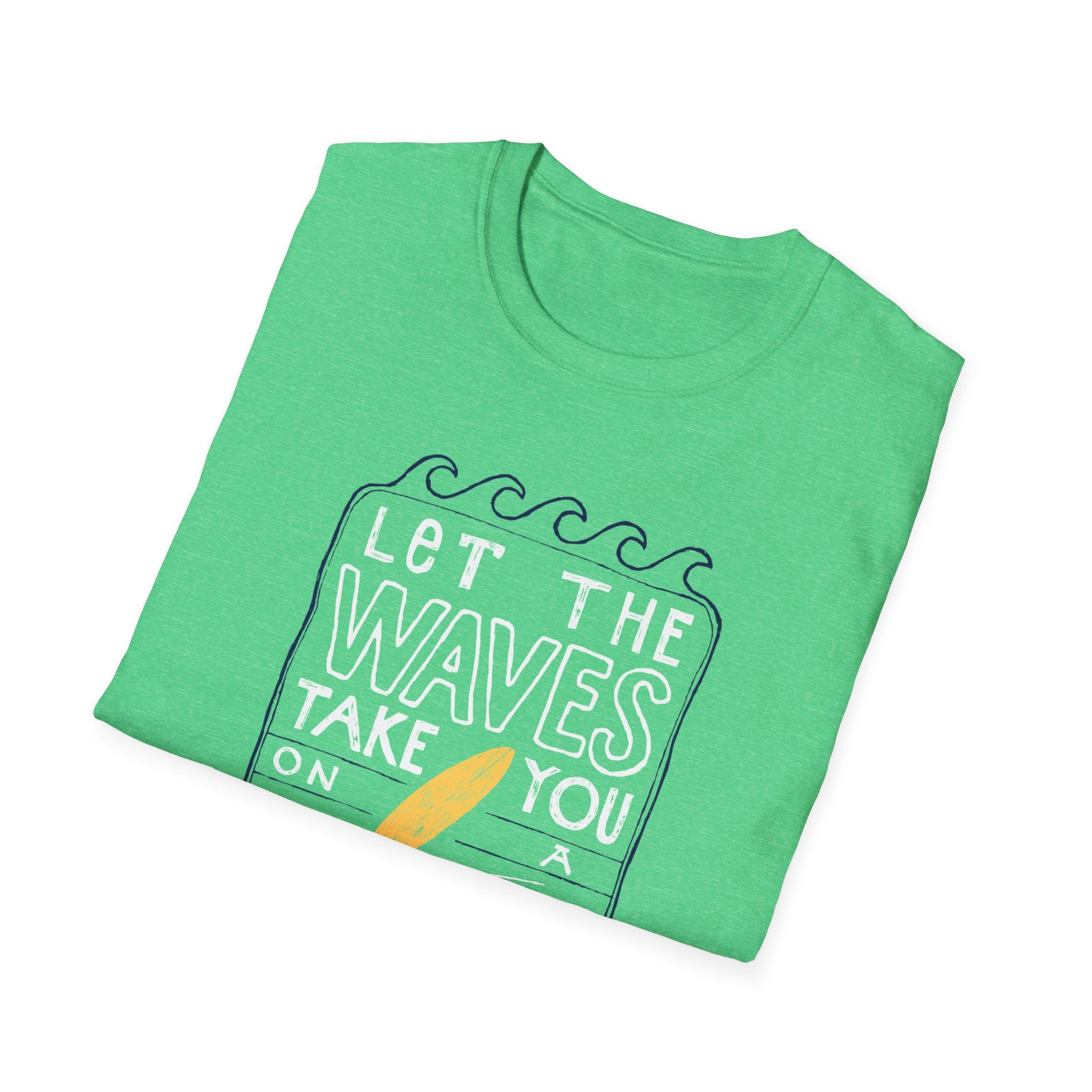 A stylish folded green "Let the Waves Take You On a Journey" T-shirt features a surfing theme with the text "Let the waves take you on" and a surfboard graphic, ideal for those who embrace self-discovery through unseen destinations.