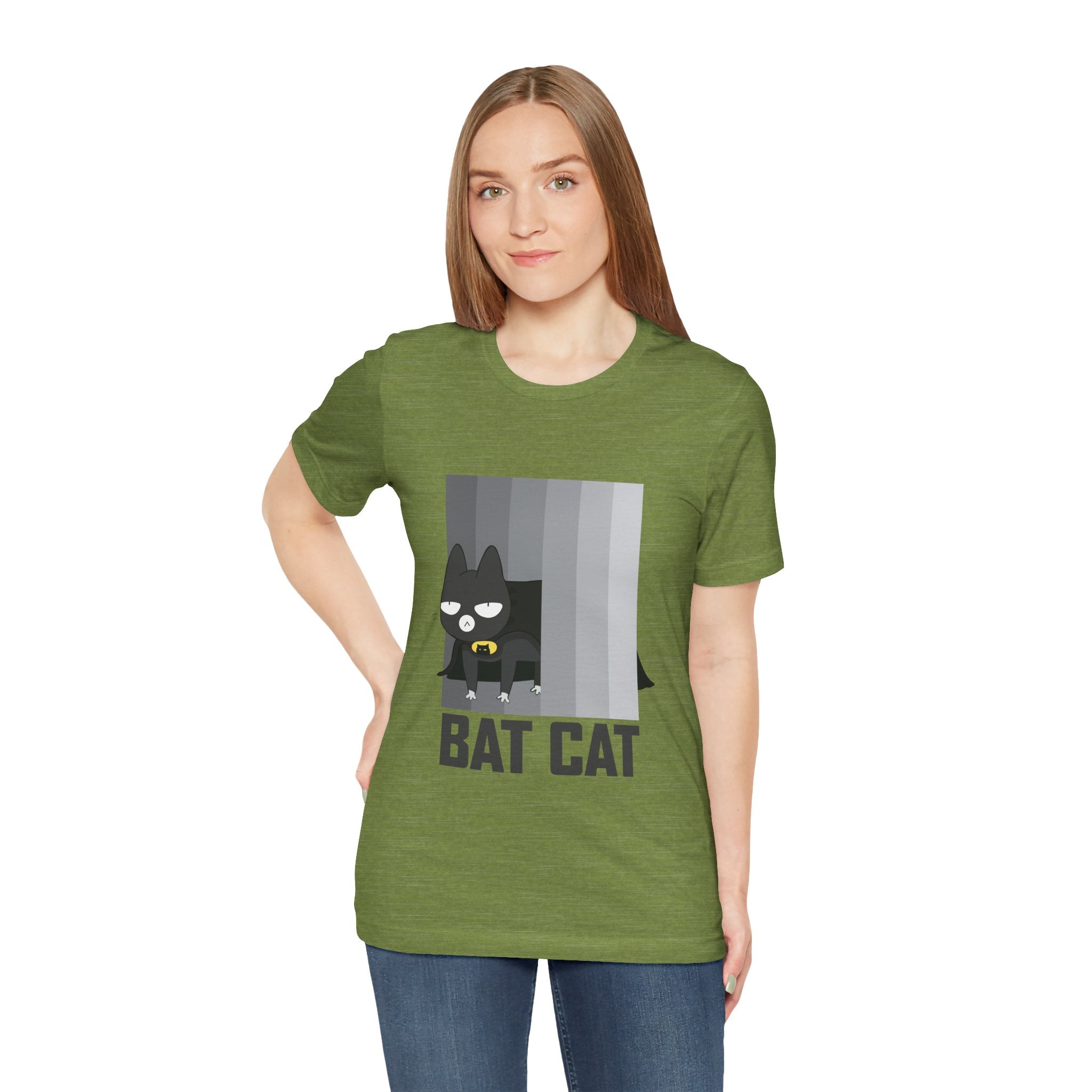 A woman in a green unisex tee with a BATCAT T-Shirt graphic design, standing against a plain background.