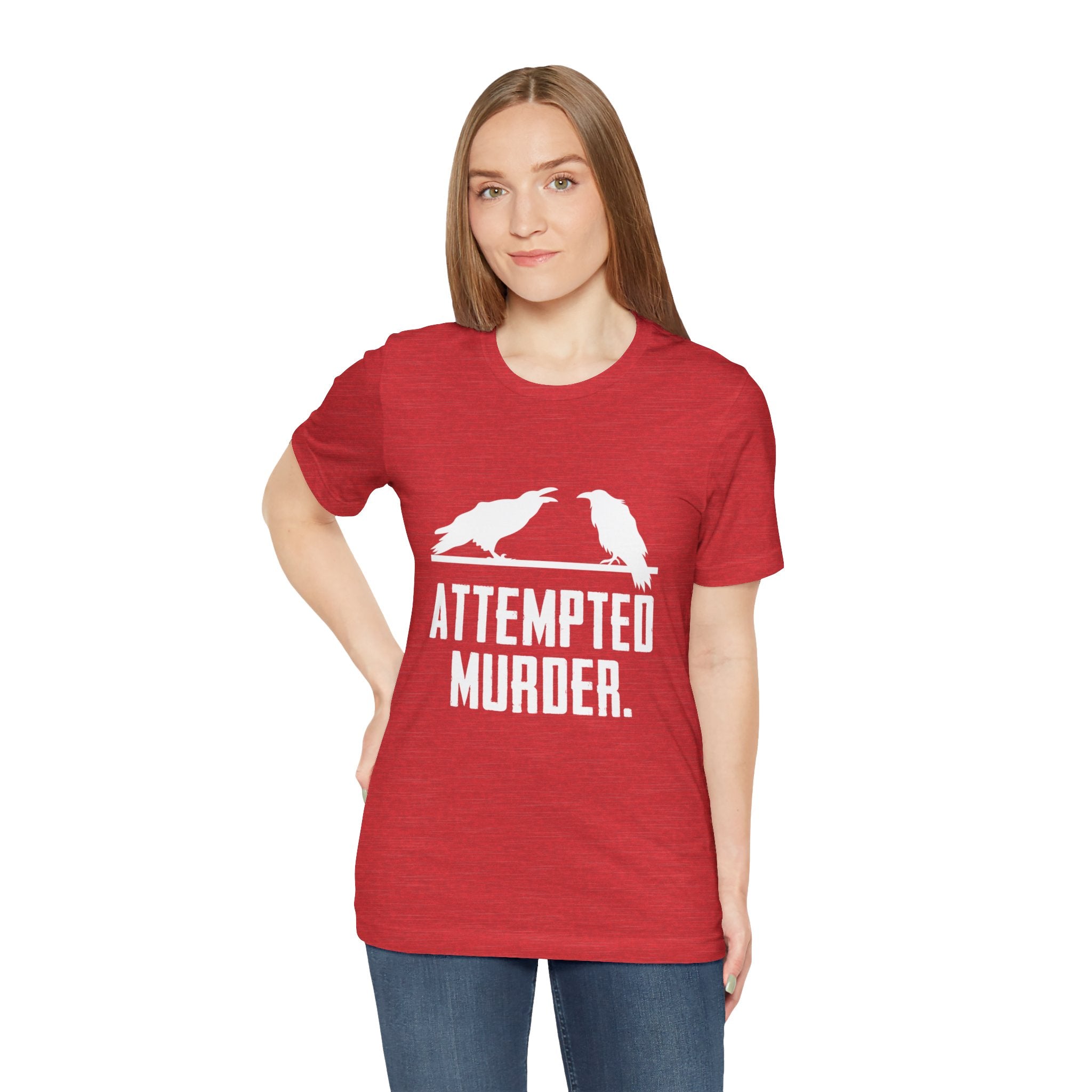 An individual wearing a stylish red Attempted Murder T-Shirt featuring two crows and the clever phrase "Attempted Murder.