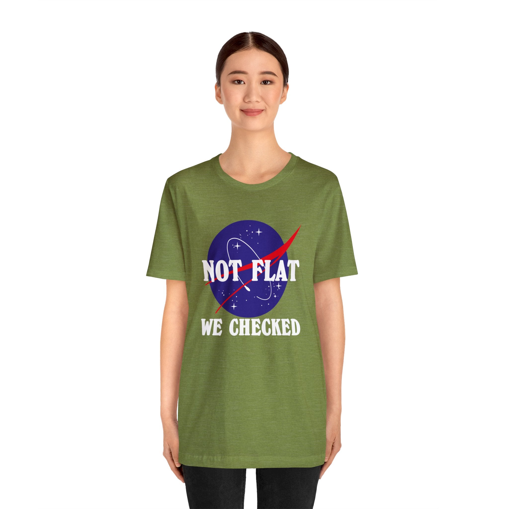 A woman wearing a green Earth Not Flat T-Shirt.