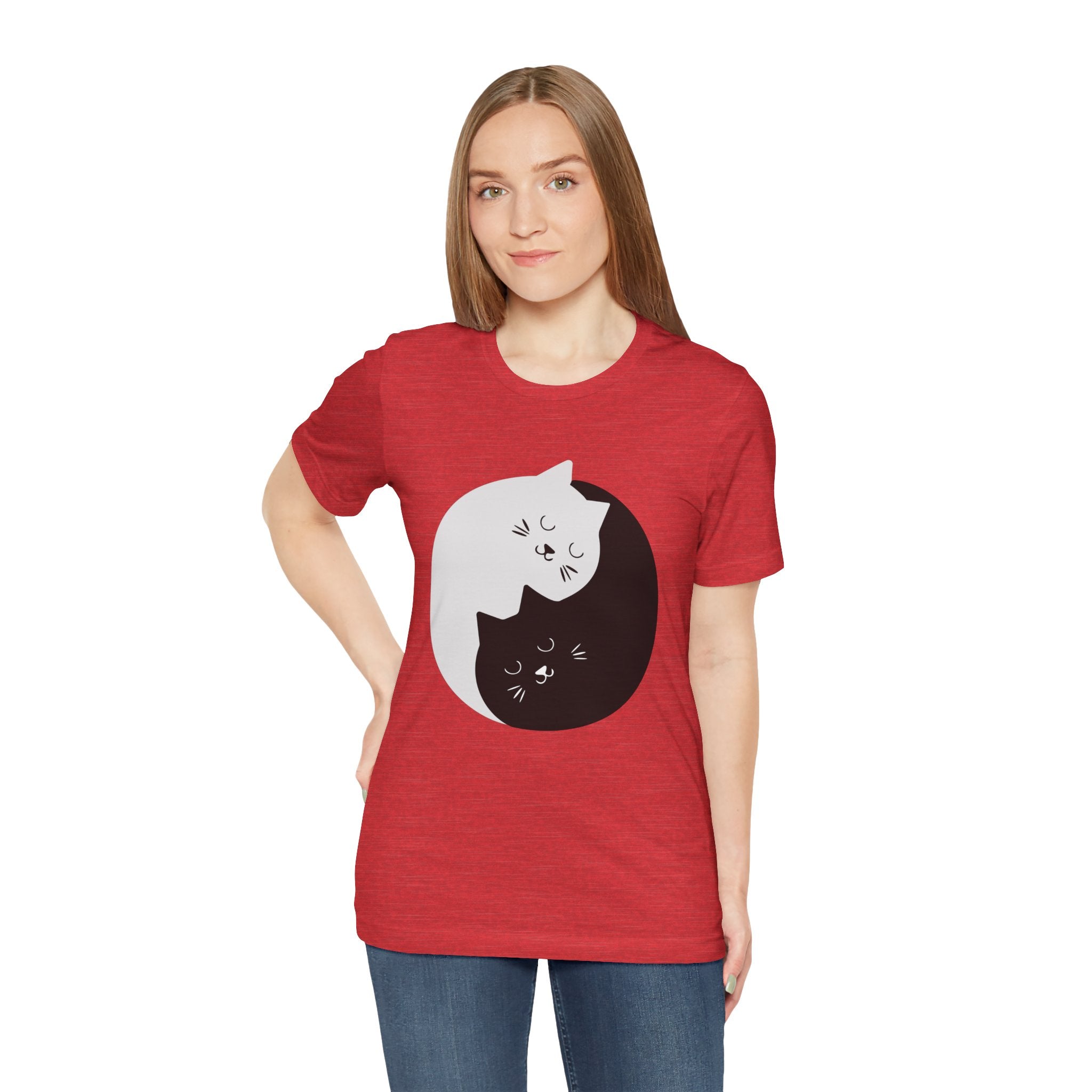 Young woman in a YING-ANG KITTIES T-Shirt, standing against a plain background.