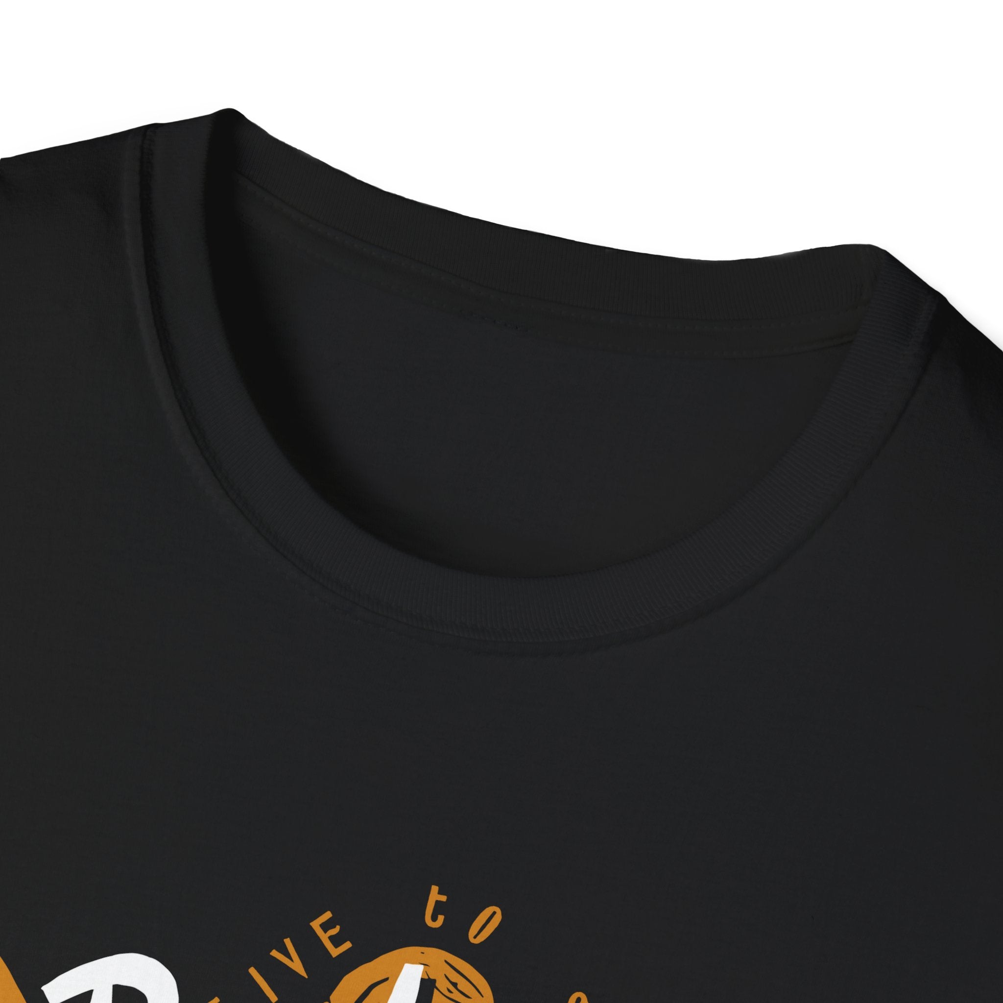 Close-up of the Ride the Wave T-Shirt, featuring black cotton fabric with partial orange and white graphic text near the neckline.