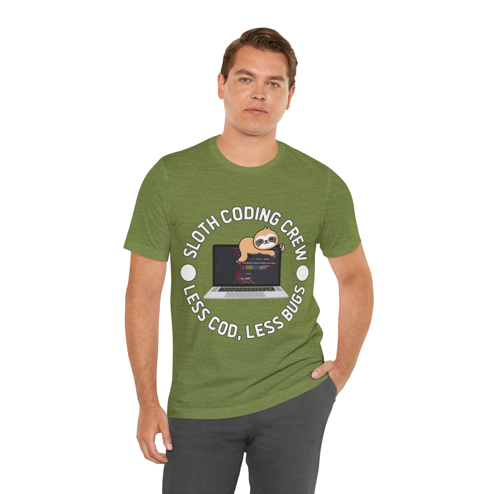 A man wearing a green unisex jersey tee with "Sloth Coding Crew Less Cod Less Bugs" and an image of a sloth on a laptop printed on it.