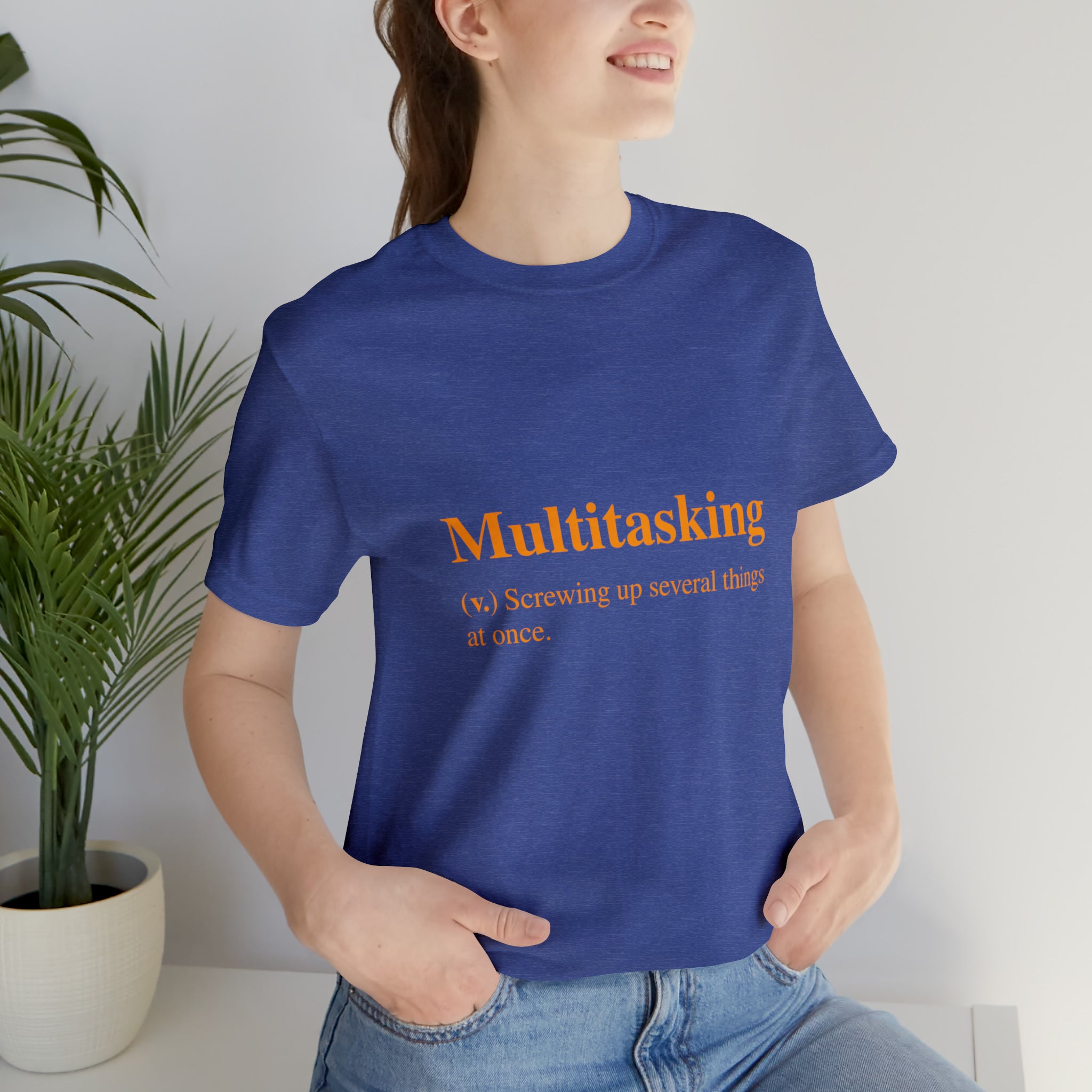 A woman wearing a Multitasking T-Shirt, showcasing her sense of fashion.