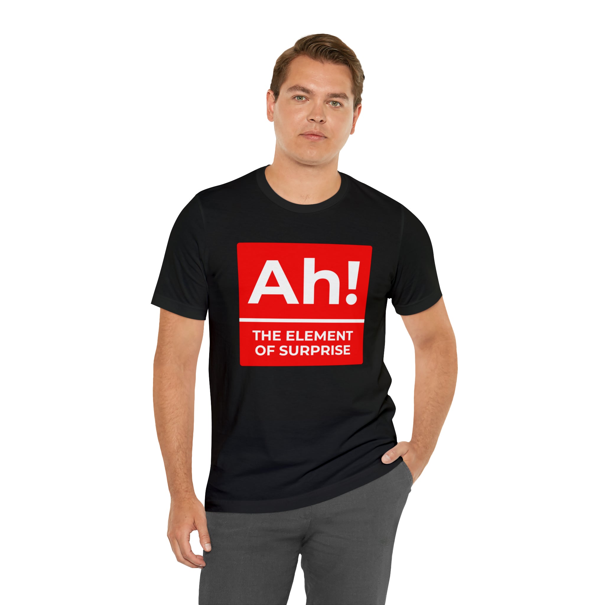 A man wearing a black Ah! the Element of Surprise T-shirt with a background in science.