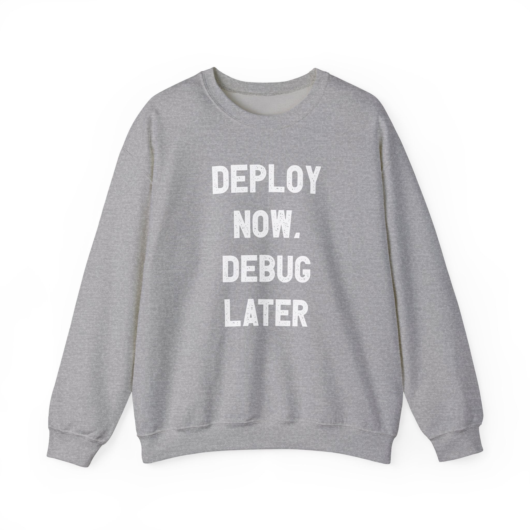 Introducing the "Deploy Now, Debug Later" sweatshirt in gray, designed specifically for tech enthusiasts. It features striking white printed text and is perfect for staying warm and cozy during the colder months.