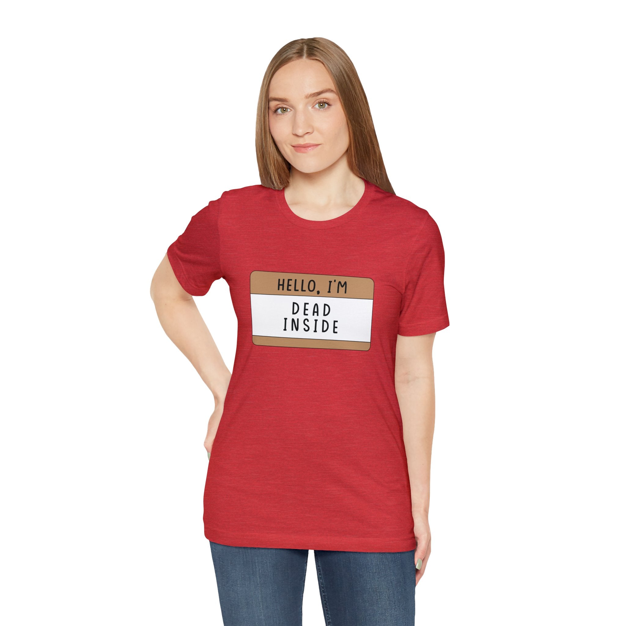 A woman in a red Hello, I'm Dead Inside T-Shirt with the phrase "hello, I'm dead inside" featuring a quirky design, standing against a plain background.